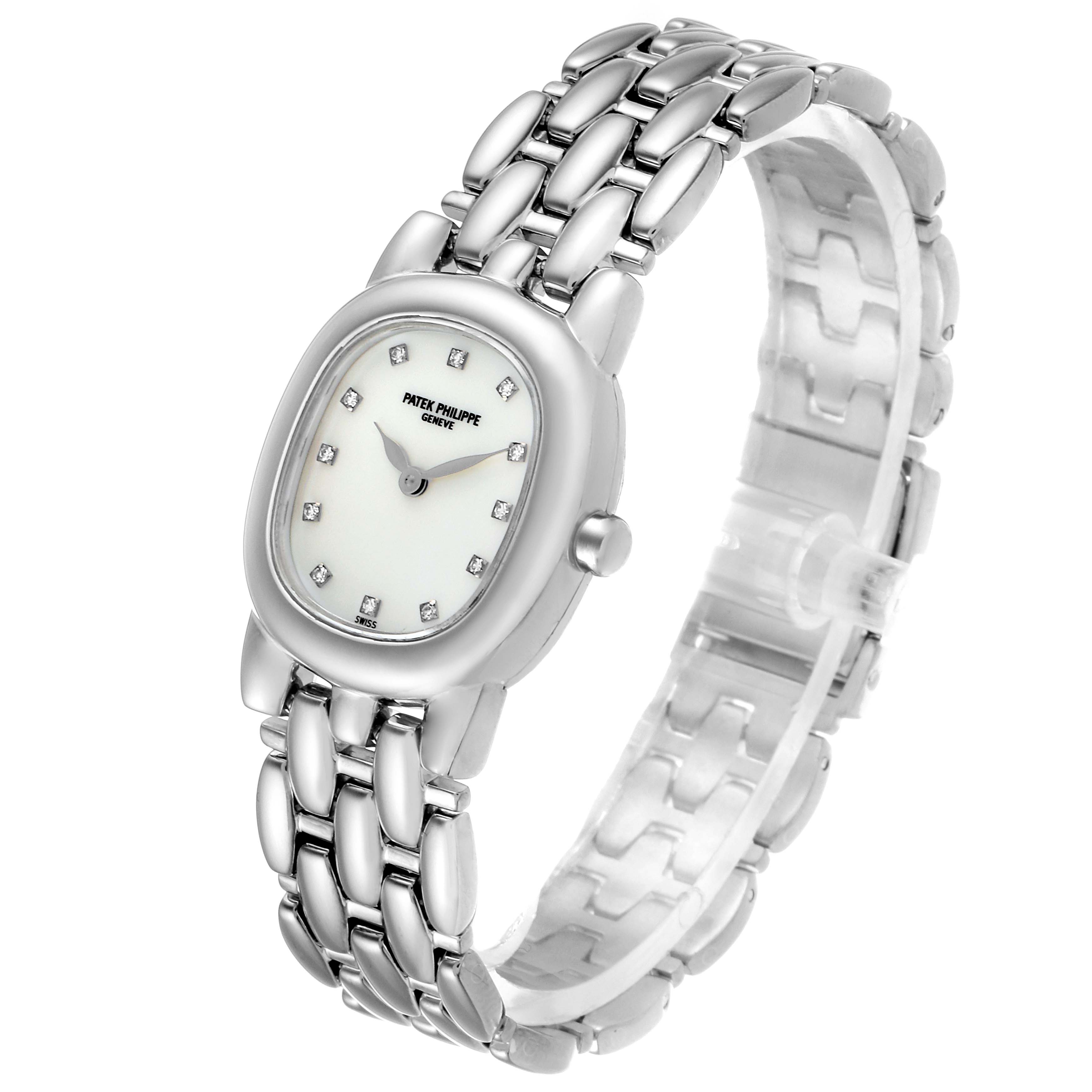 The image shows a side perspective of a Patek Philippe Golden Ellipse 4830 Women's White Gold Mother of Pearl Dial 4830 Women's White Gold Mother of Pearl Dial watch, highlighting the face, bracelet, and bezel.