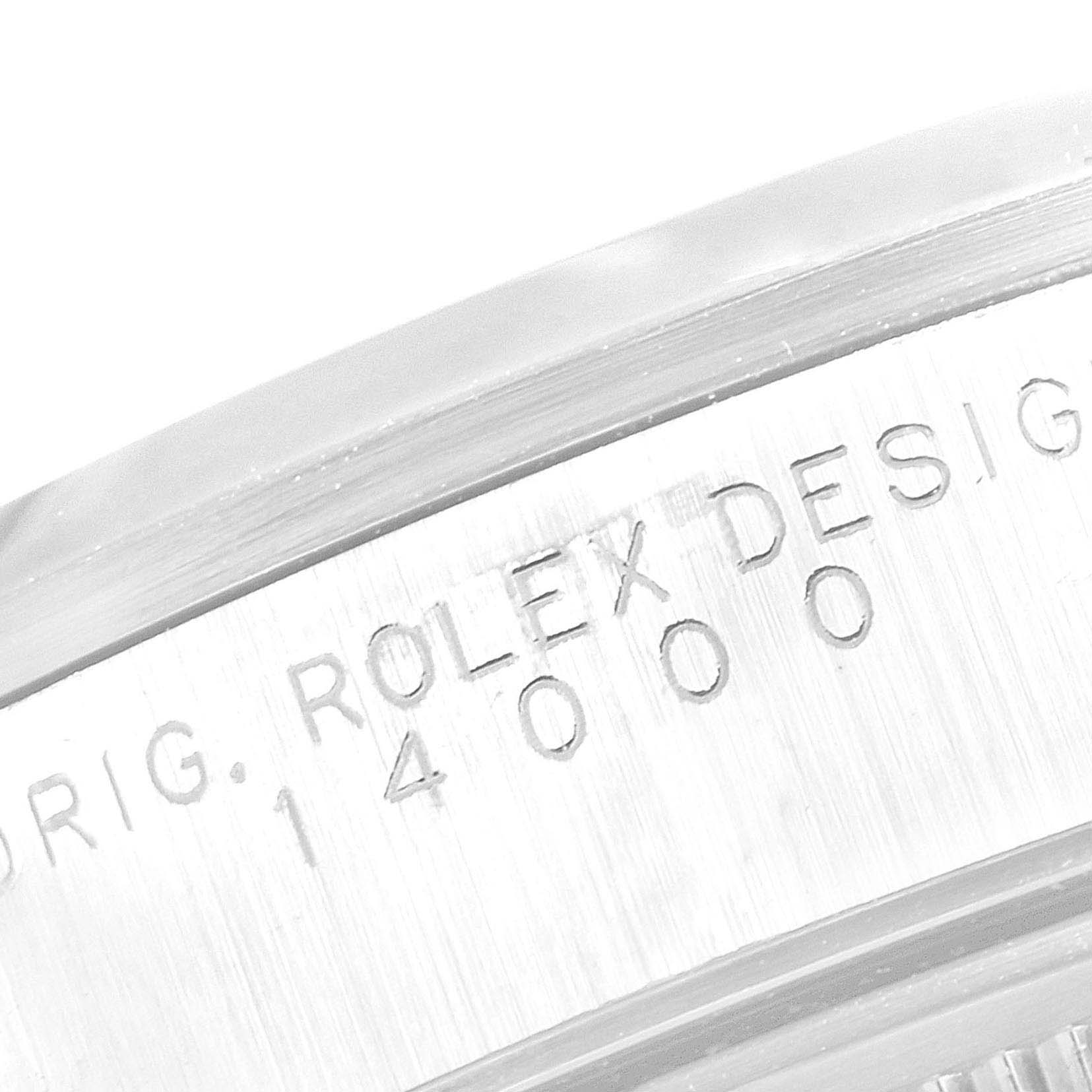 The image shows a close-up of the side of a Rolex Air-King 14000M Men's Stainless Steel Blue Dial 14000M Men's Stainless Steel Blue Dial watch, focusing on the engraved model number and branding.