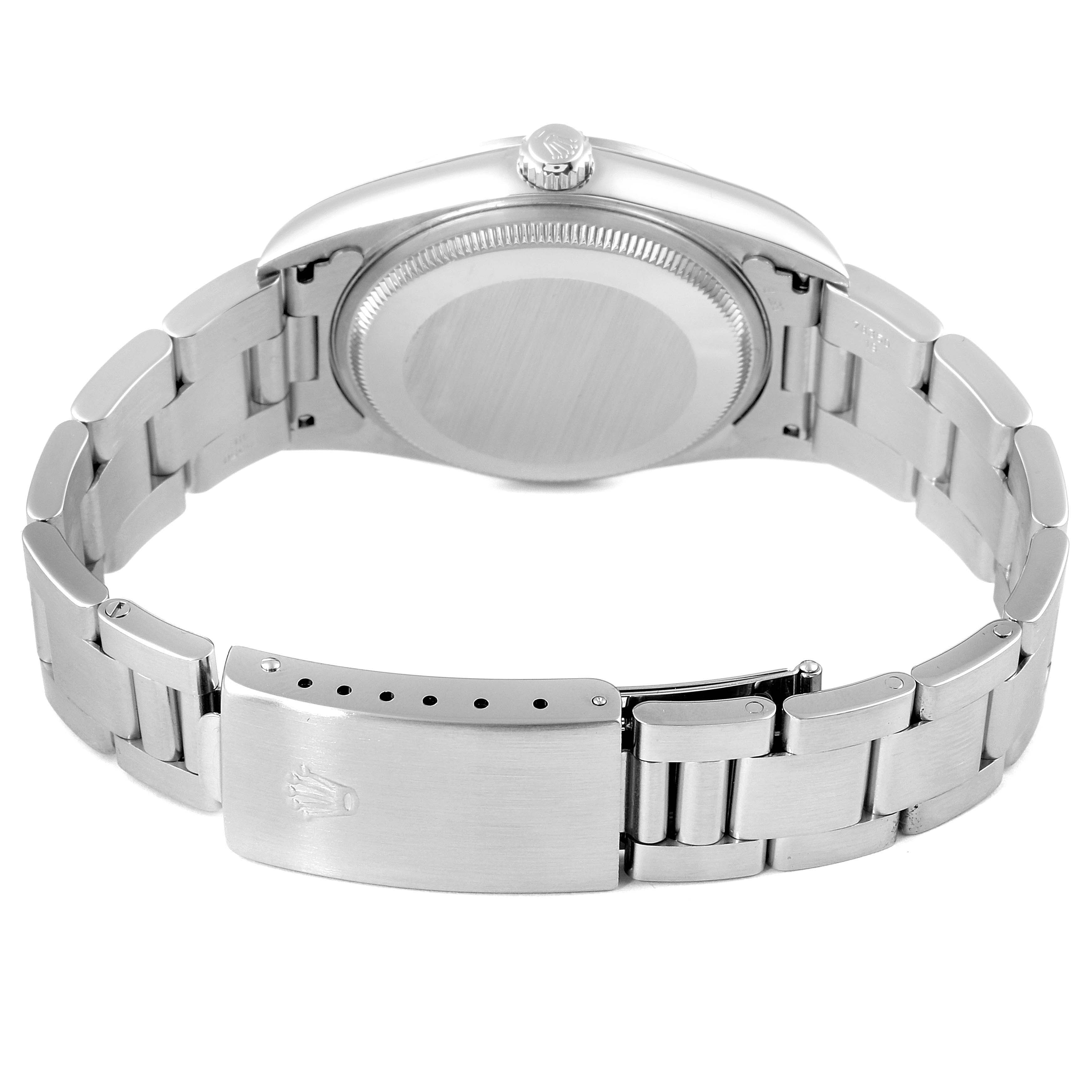 The image shows the back view of a Rolex Air-King 14000M Men's Stainless Steel Blue Dial 14000M Men's Stainless Steel Blue Dial watch, highlighting the case back and metal bracelet with the clasp open.