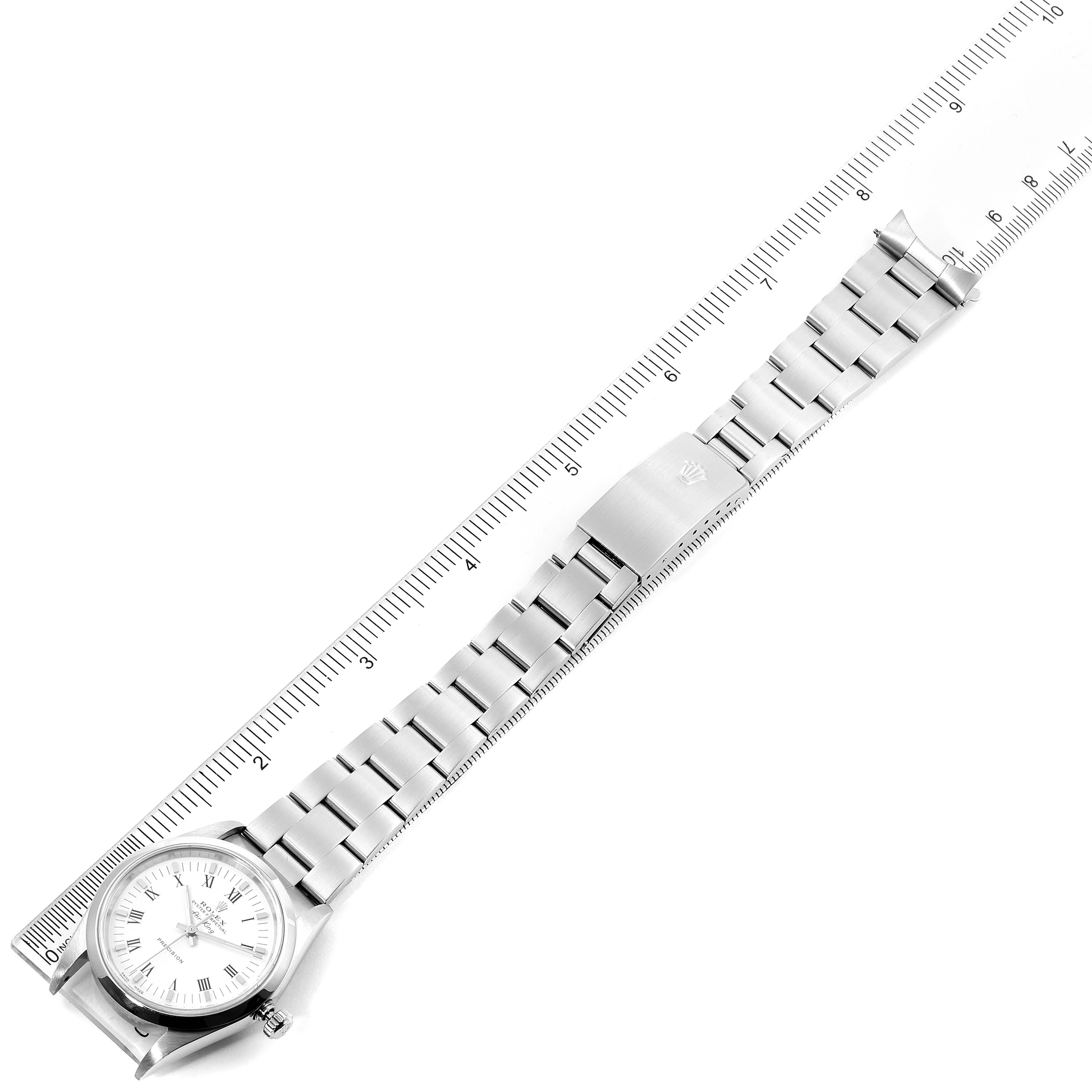 This image shows a top-down view of a Rolex Air-King 14000 Men's Stainless Steel White Dial 14000 Men's Stainless Steel White Dial watch, displaying the full length of its bracelet alongside a ruler for scale.