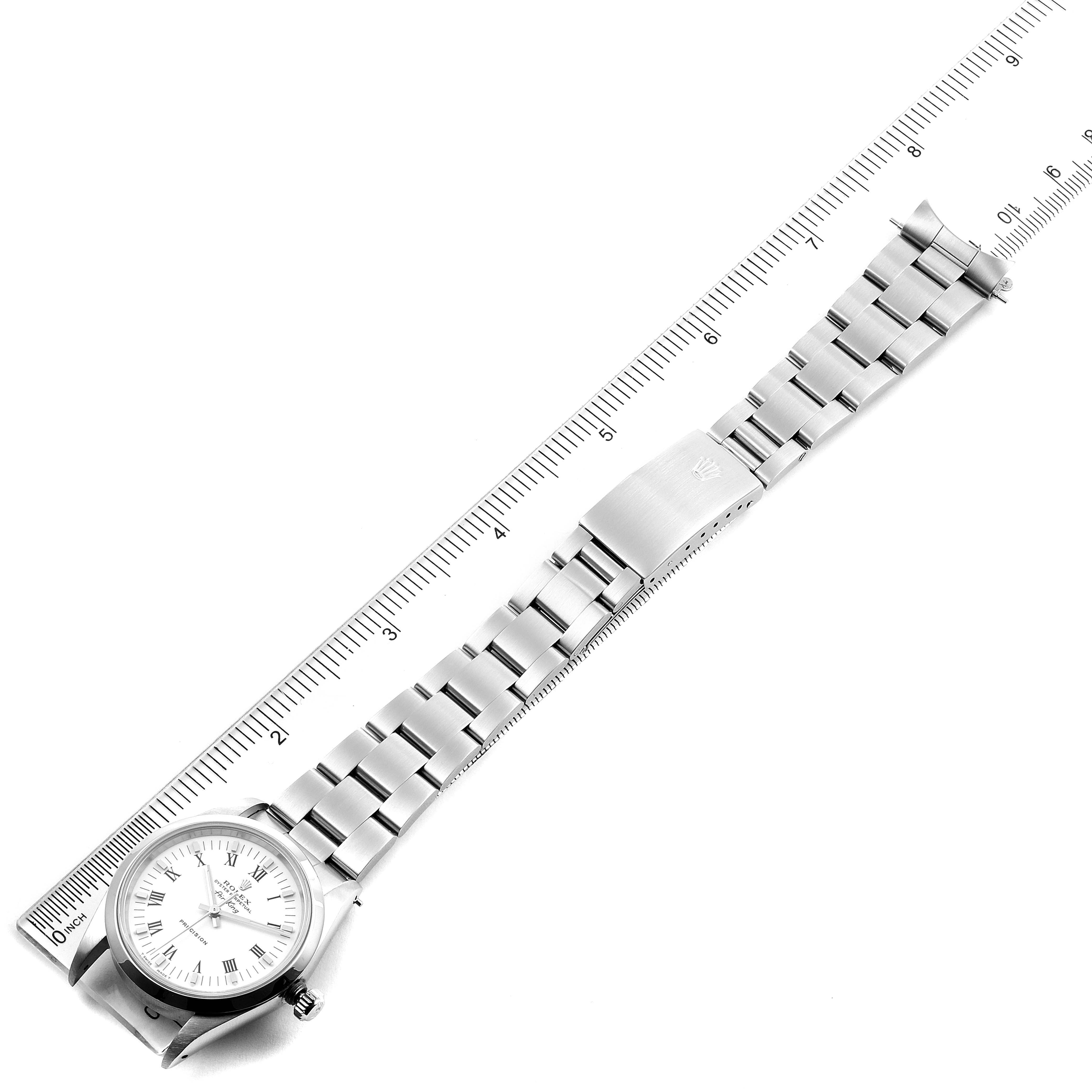 The image shows a top-down view of a Rolex Air-King 14000 Men's Stainless Steel White Dial 14000 Men's Stainless Steel White Dial watch, displaying its dial, bracelet, and clasp alongside a ruler.