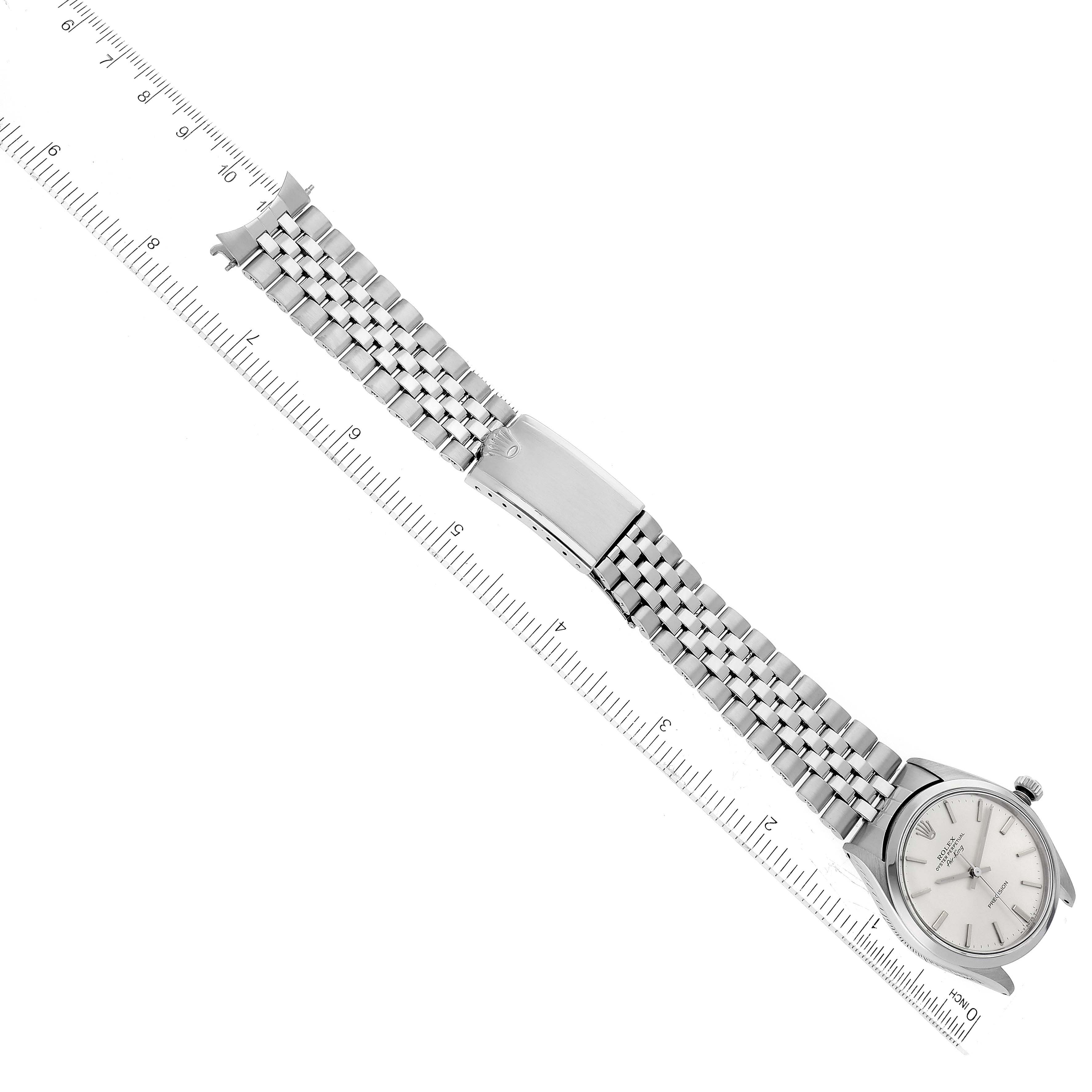 The Rolex Vintage Collection 5500 Men's Stainless Steel Silver Dial 5500 Men's Stainless Steel Silver Dial watch is shown at an angled top view, displaying the entire face, bracelet, and clasp alongside a ruler for scale.