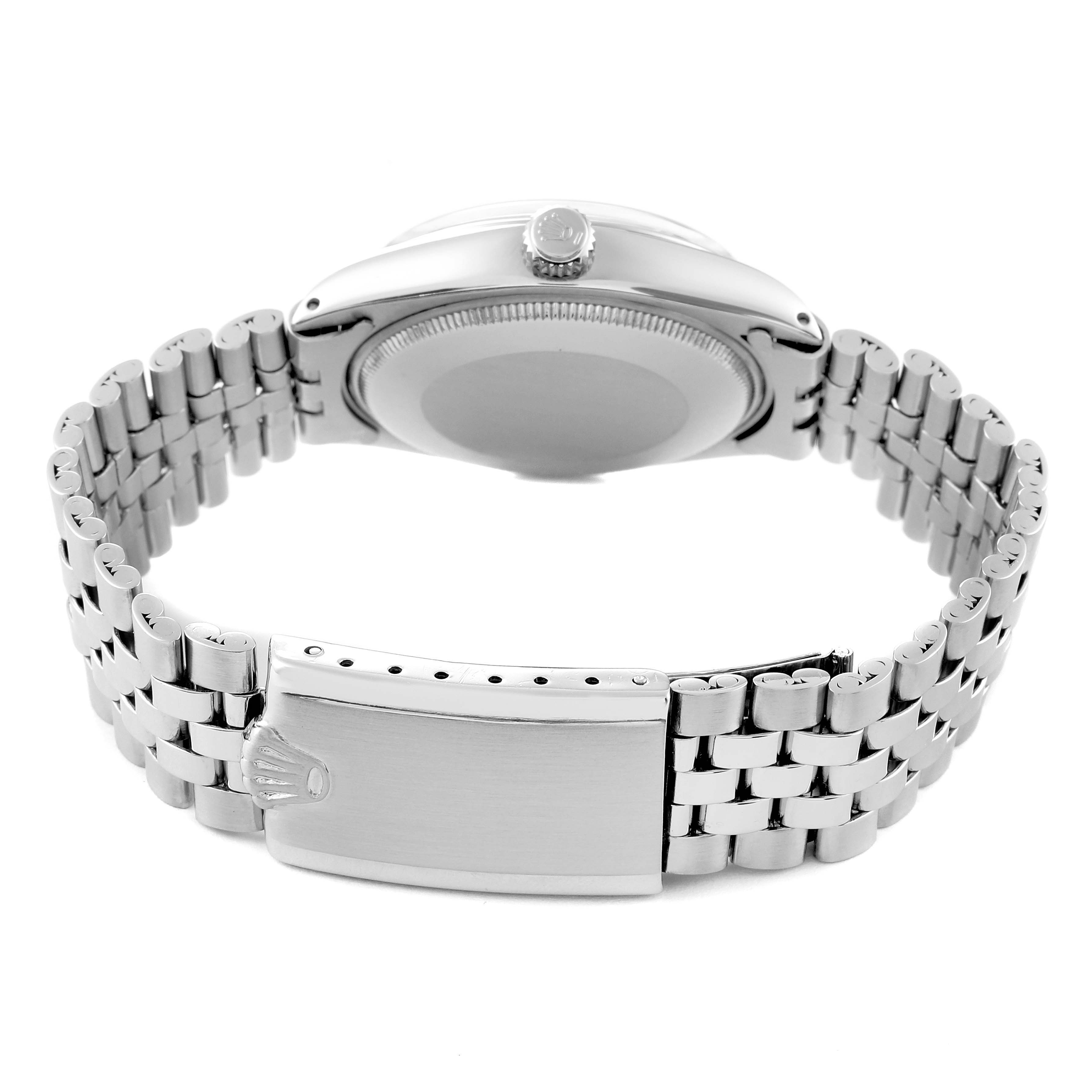 The image shows the back view of a Vintage Collection Rolex watch, highlighting its metal bracelet and clasp.