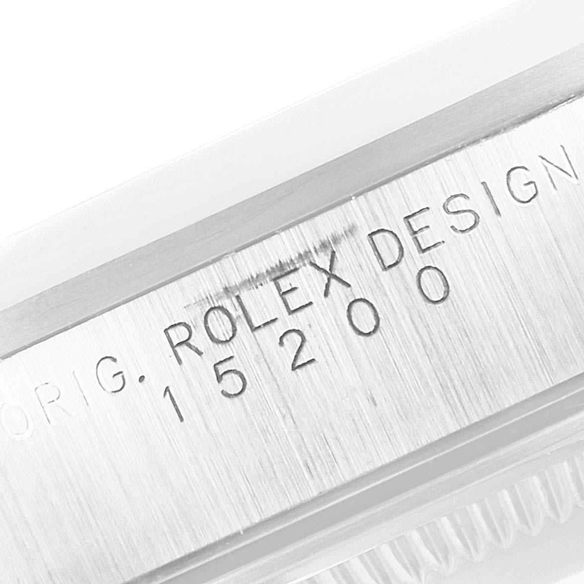 This image shows a close-up of the case side, detailing the engraved model number "15200" and "ROLEX DESIGN" of the Rolex Date 15200 Men's Stainless Steel White Dial 15200 Men's Stainless Steel White Dial watch.