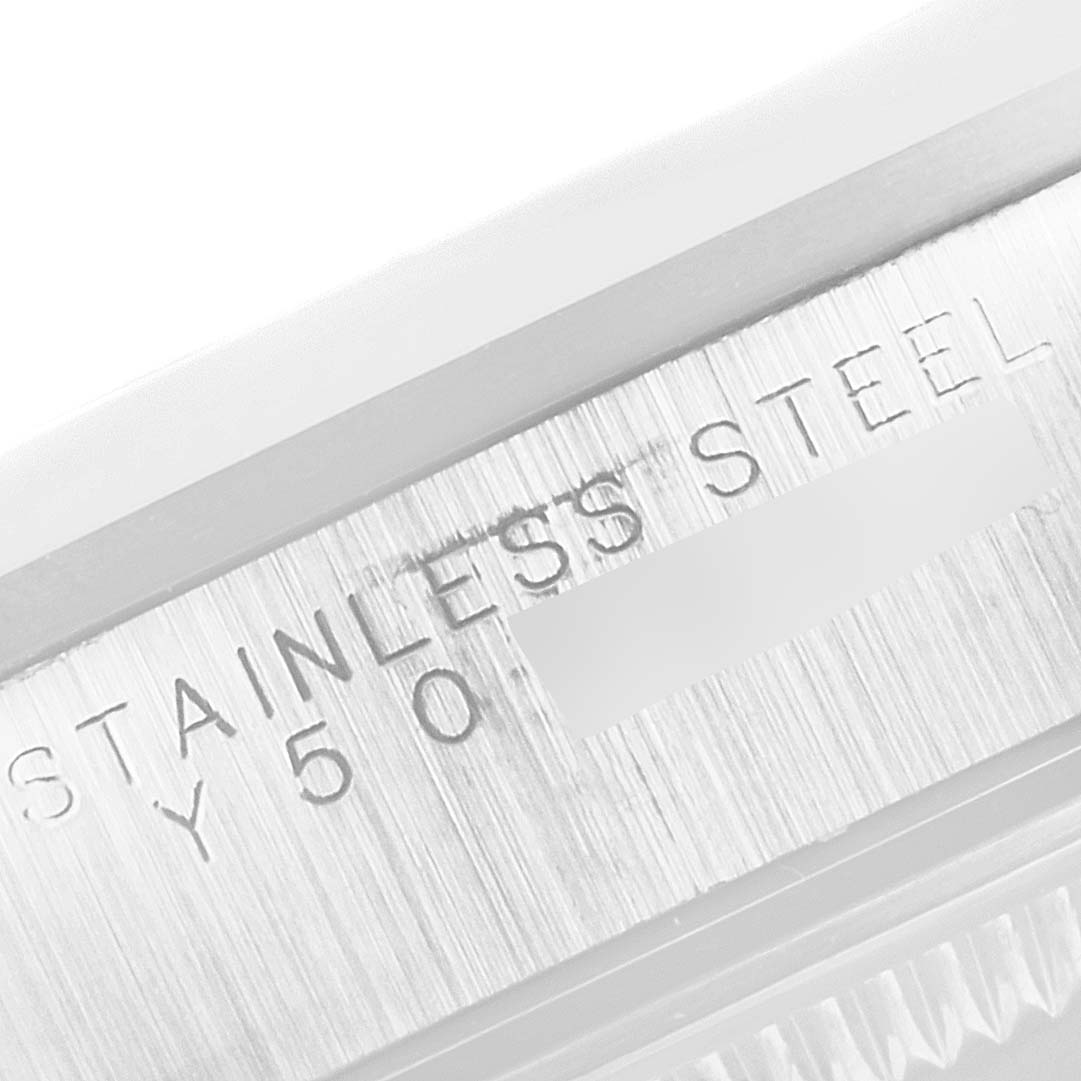 This is a close-up shot of the side of a Rolex Date 15200 Men's Stainless Steel White Dial 15200 Men's Stainless Steel White Dial model showing the engraved "STAINLESS STEEL Y50" text.