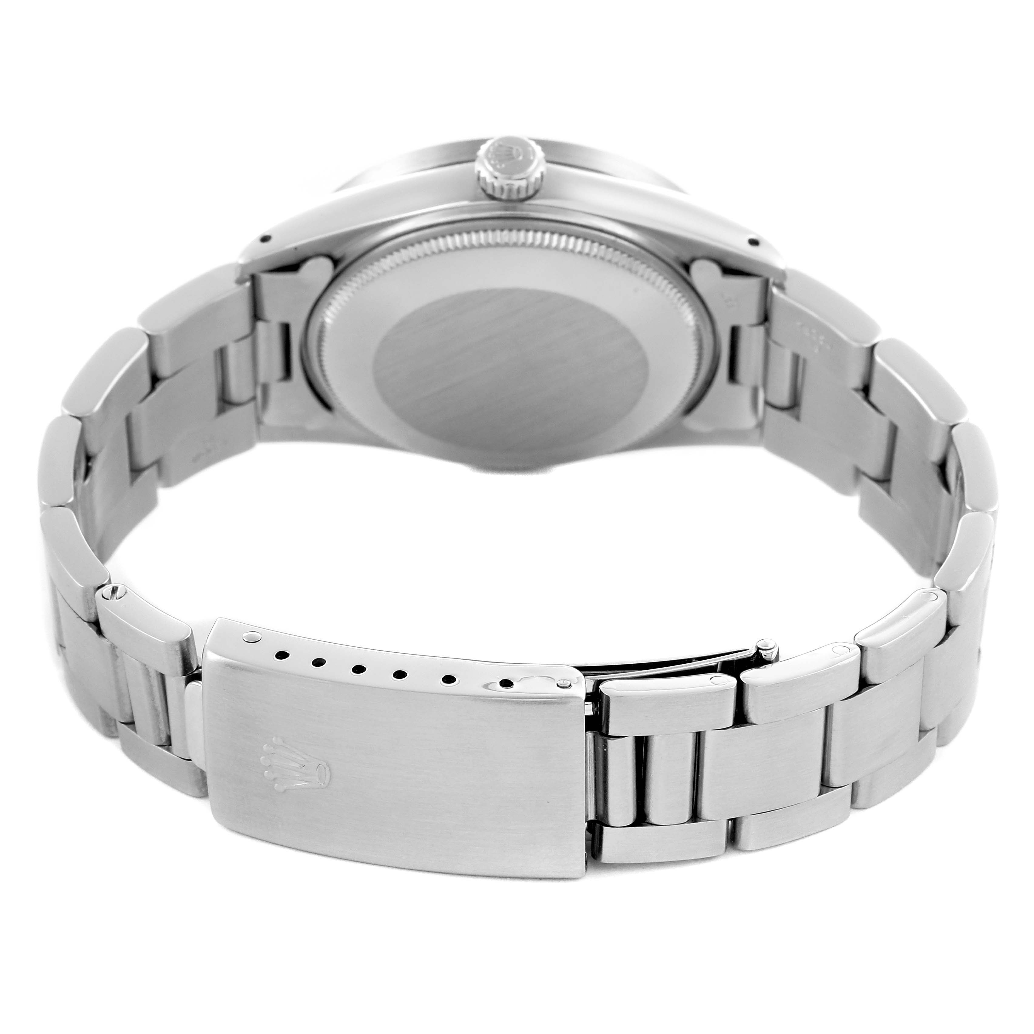 The Rolex Date 15010 Men's Stainless Steel Silver Dial 15010 Men's Stainless Steel Silver Dial model is shown from the back, highlighting the case back, crown, and bracelet clasp.