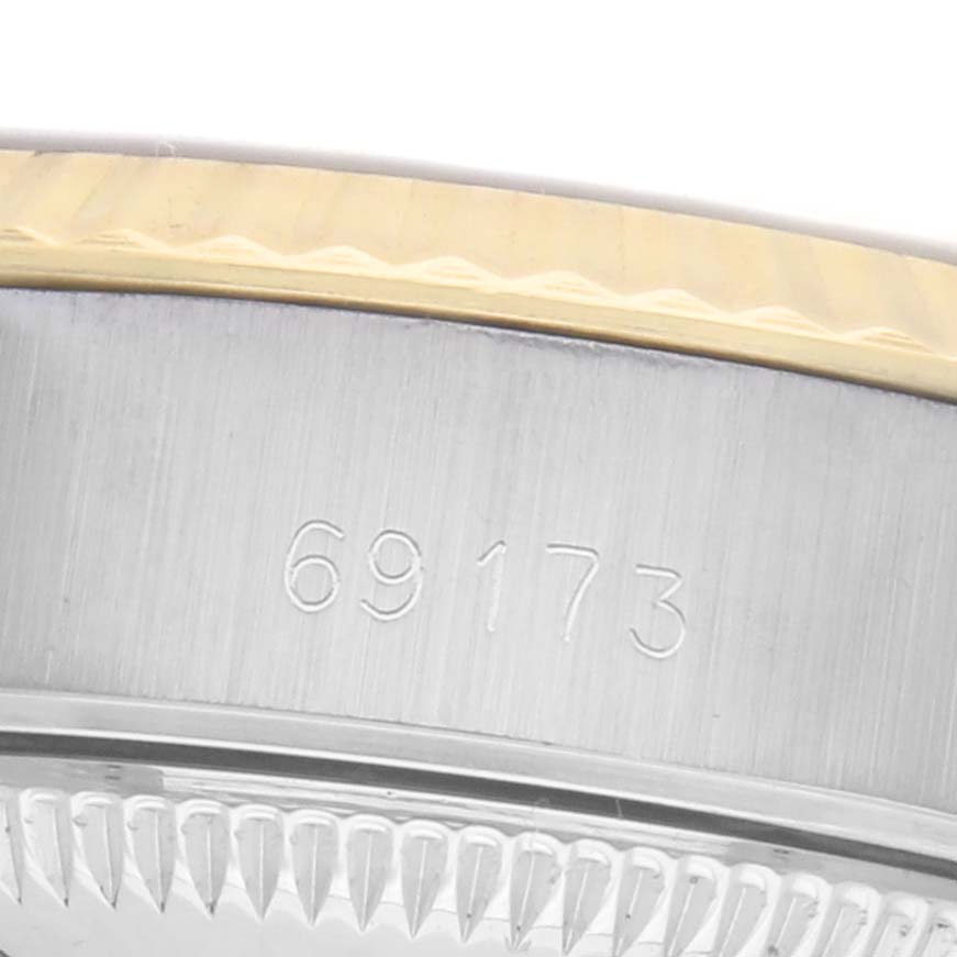 The image shows a close-up of the Rolex Datejust 69173 Women's Steel and Gold (two tone) Champagne Dial model's case side, highlighting the model number and the edge of the bezel.