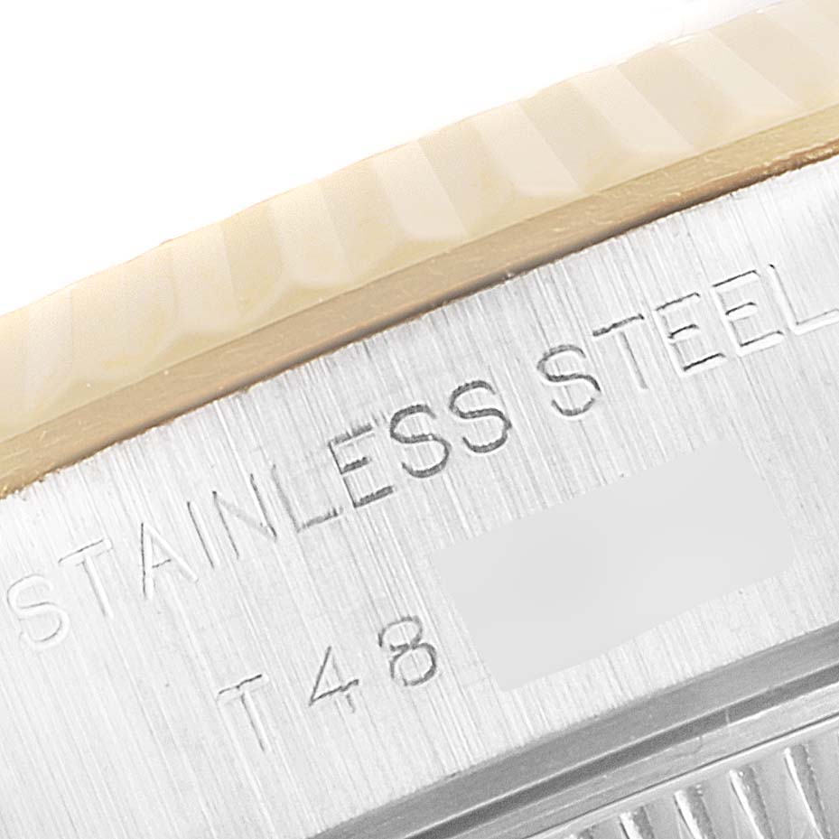 This image shows a close-up of the side engraving on the stainless steel case of a Rolex Datejust 69173 Women
s Steel and Gold (two tone) Champagne Dial 69173 Women
s Steel and Gold (two tone) Champagne Dial model watch.