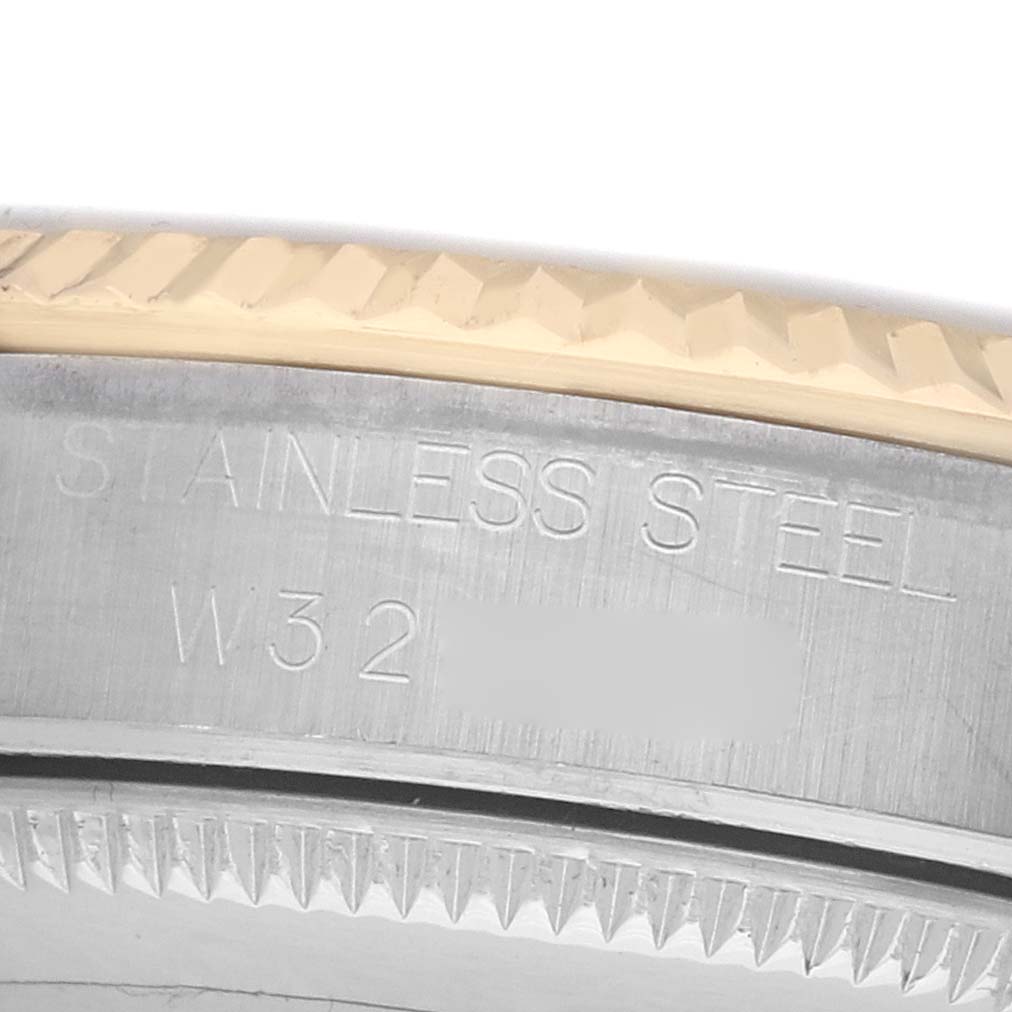 The image shows a close-up of the side of a Rolex Datejust 68273 Women's Steel and Gold (two tone) Champagne Dial watch, highlighting the stainless steel case and the fluted bezel.