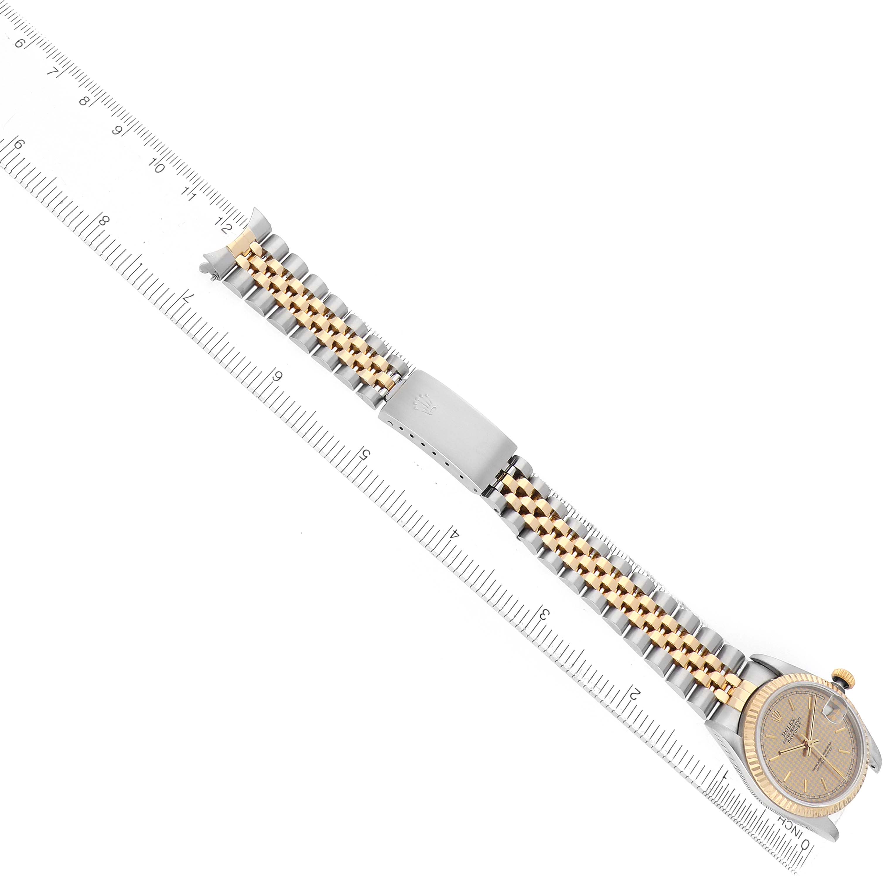 The image shows a Rolex Datejust 68273 Women's Steel and Gold (two tone) Champagne Dial watch from a top angle, highlighting the bracelet, clasp, and part of the watch face.