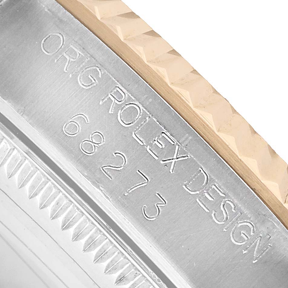 The image shows a close-up of the case side of a Rolex Datejust 68273 Women's Steel and Gold (two tone) Grey Dial, highlighting the model number and design engraving.