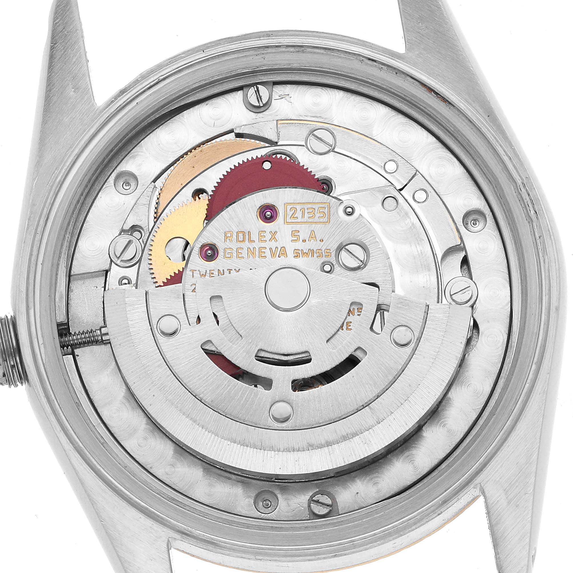 The image shows the movement of a Rolex Datejust 68273 Women's Steel and Gold (two tone) Grey Dial watch from the back, highlighting gears and inscriptions.