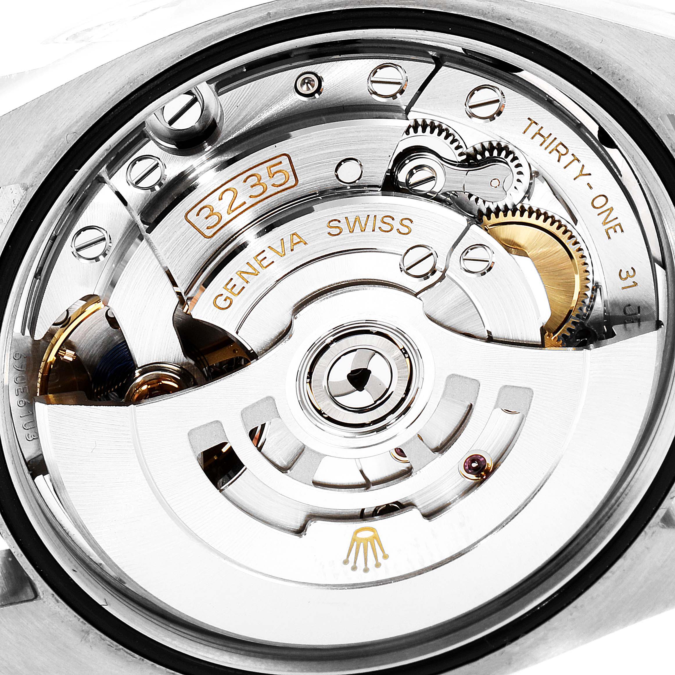 This is the inner mechanism, particularly the movement, of a Rolex Datejust 126200 Men's Stainless Steel Silver Dial 126200 Men's Stainless Steel Silver Dial watch, viewed from the back.