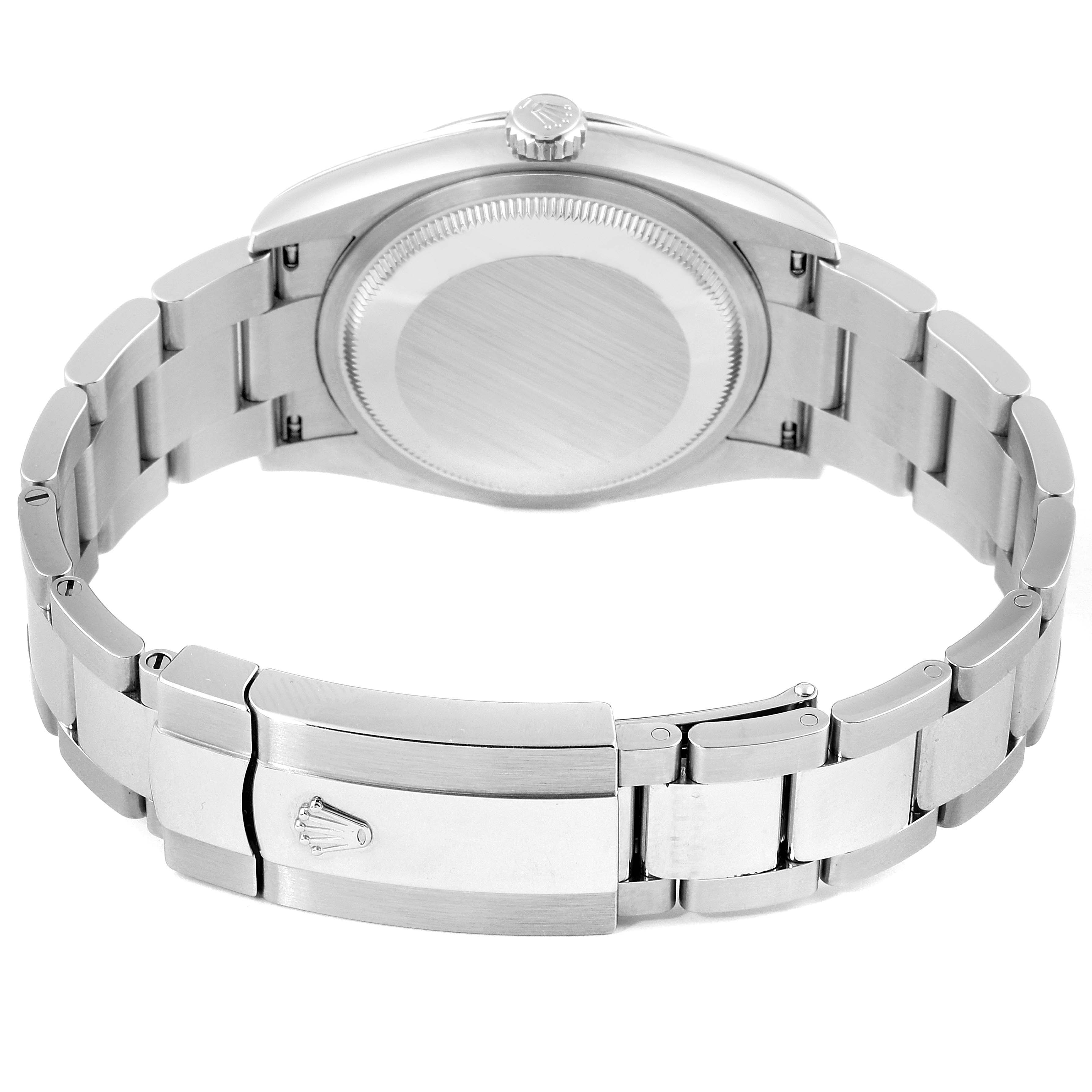 The image shows the back view of a Rolex Datejust 126200 Men's Stainless Steel Silver Dial 126200 Men's Stainless Steel Silver Dial watch, focusing on the case back and metal bracelet clasp.