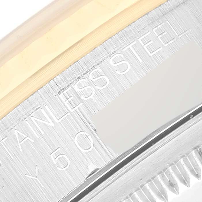 This close-up angle shows the "STAINLESS STEEL" engraving on a Rolex Datejust 16233 Men's Steel and Gold (two tone) Blue Dial 16233 Men's Steel and Gold (two tone) Blue Dial watch case.