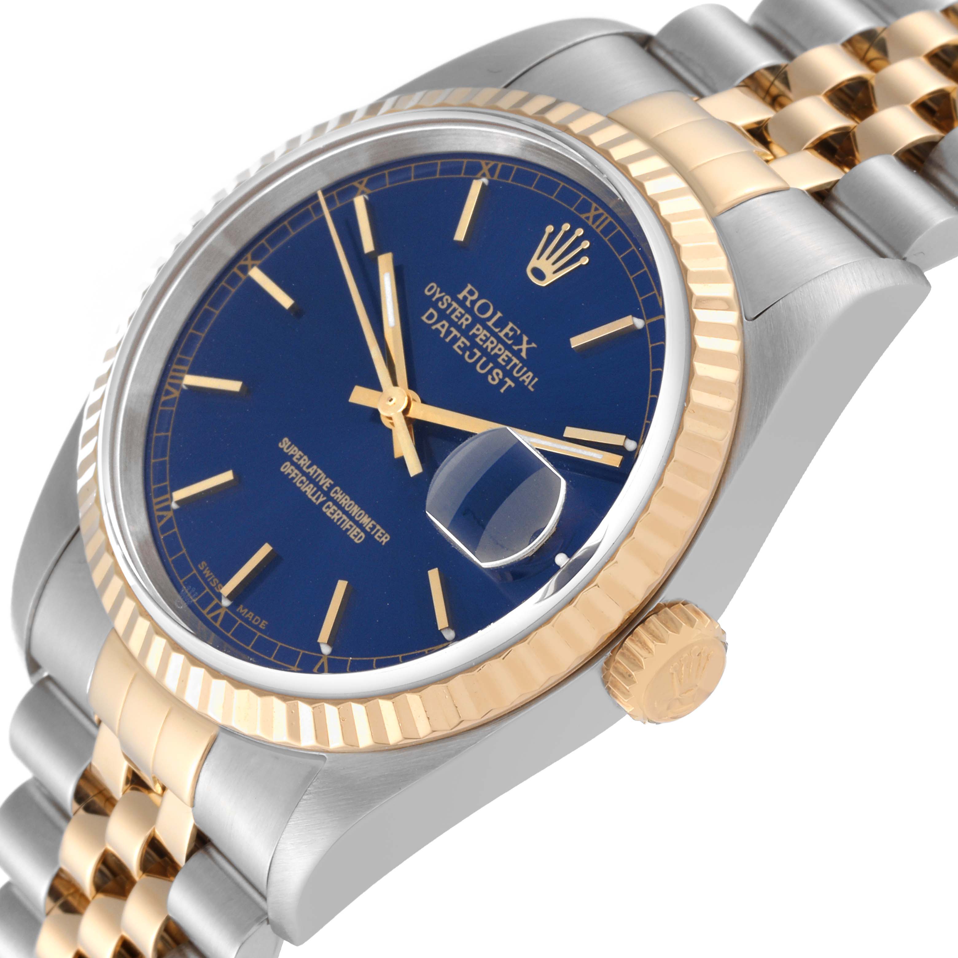 The Rolex Datejust 16233 Men's Steel and Gold (two tone) Blue Dial 16233 Men's Steel and Gold (two tone) Blue Dial watch is shown at an angled view, highlighting its blue dial, gold fluted bezel, and two-tone bracelet.