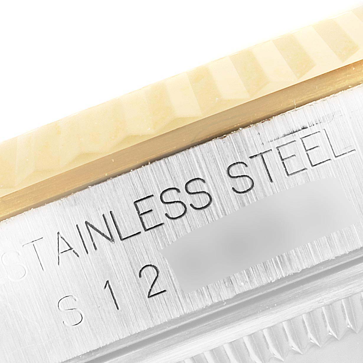 This image shows a close-up of the bezel and stainless steel case of a Rolex Datejust 16233 Men's Steel and Gold (two tone) Champagne Dial 16233 Men's Steel and Gold (two tone) Champagne Dial watch.