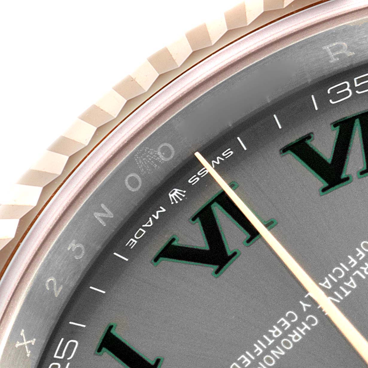 The image shows a close-up of the Rolex Datejust 41 126331 Men's Rose Gold Grey Dial 126331 Men's Rose Gold Grey Dial's bezel, chapter ring, and part of the dial with the "Swiss Made" inscription.