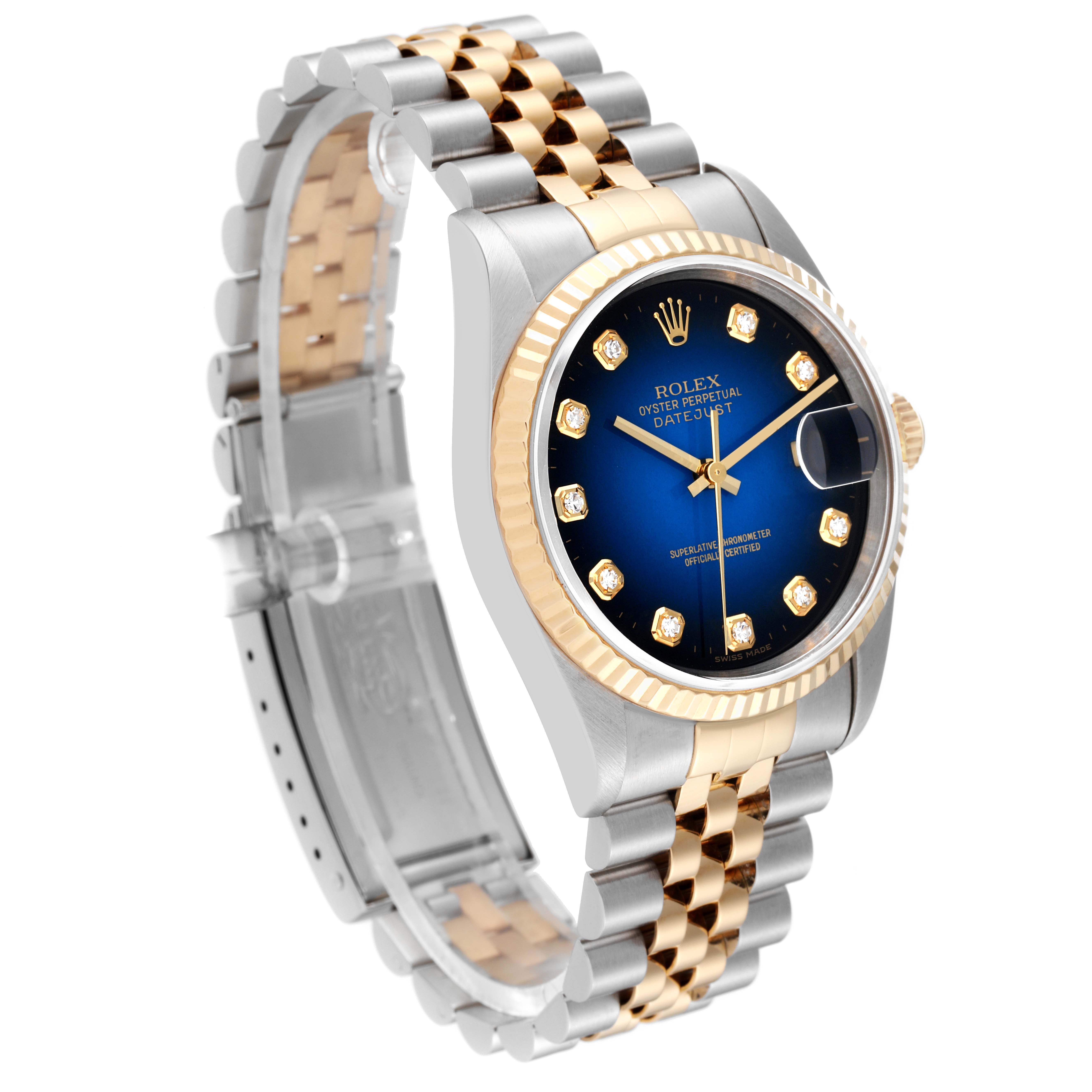 The Rolex Datejust 16233G Men's Steel and Gold (two tone) Blue Dial 16233G Men's Steel and Gold (two tone) Blue Dial watch is shown at an angle highlighting the face, bezel, and two-tone bracelet.