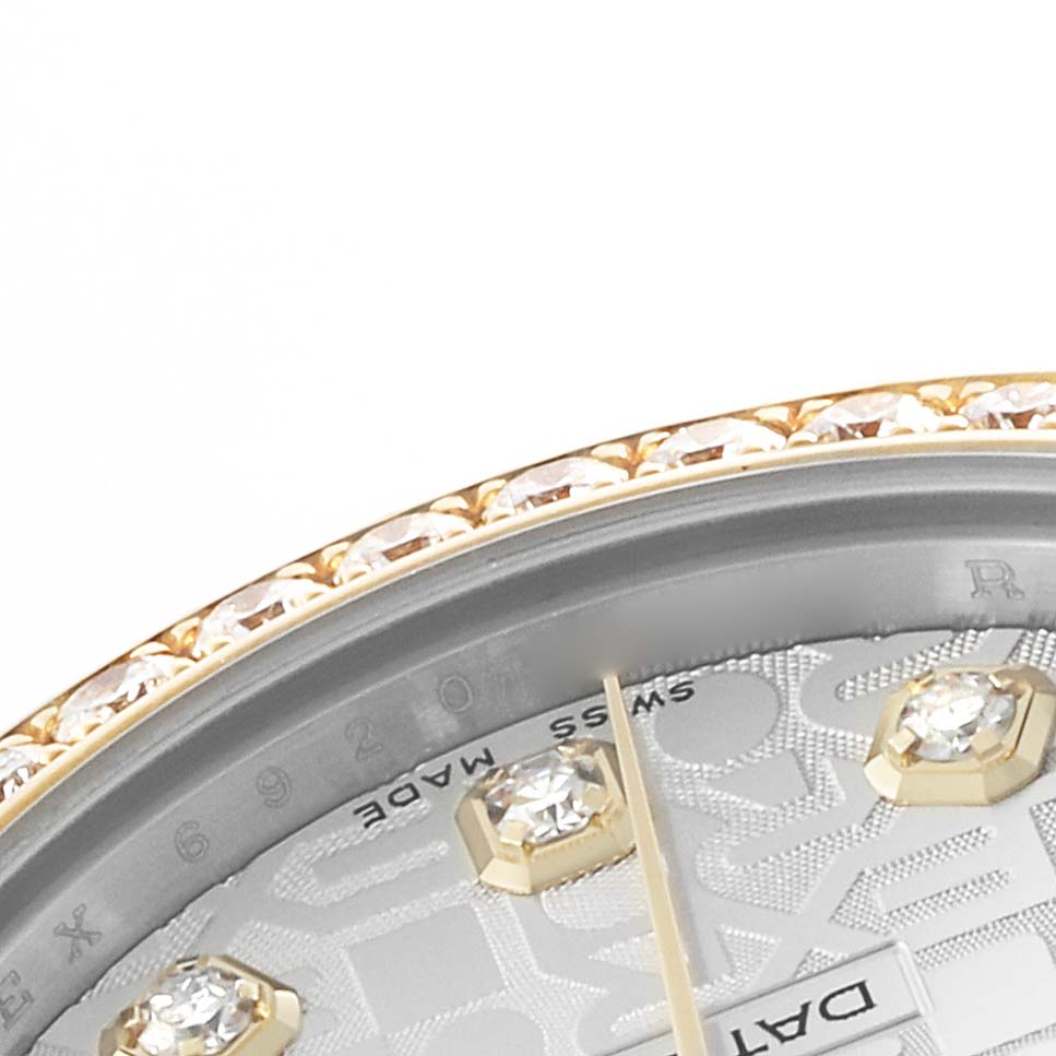 The image shows a close-up of the bezel and part of the dial of a Rolex Datejust 178383 Women's Steel and Gold (two tone) Silver Dial, highlighting diamonds and part of the branding details.