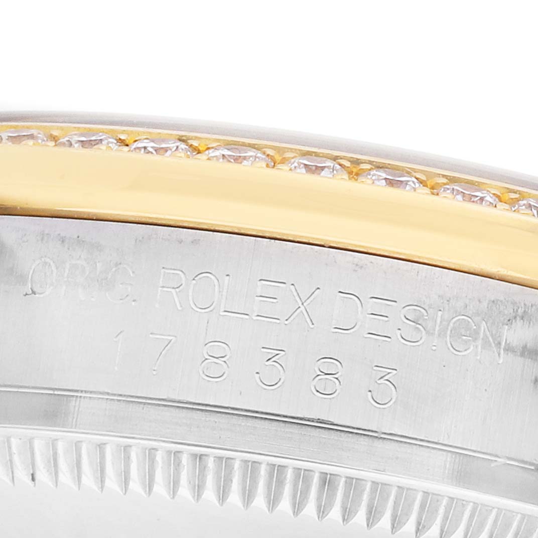 The image shows a close-up of the case side of a Rolex Datejust 178383 Women's Steel and Gold (two tone) Silver Dial, detailing the bezel and engraved model number.
