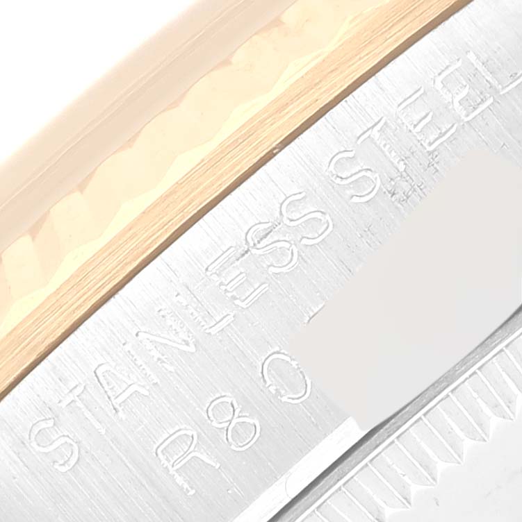 The image shows a close-up of the stainless steel case and bezel of a Mid-Size Rolex watch.