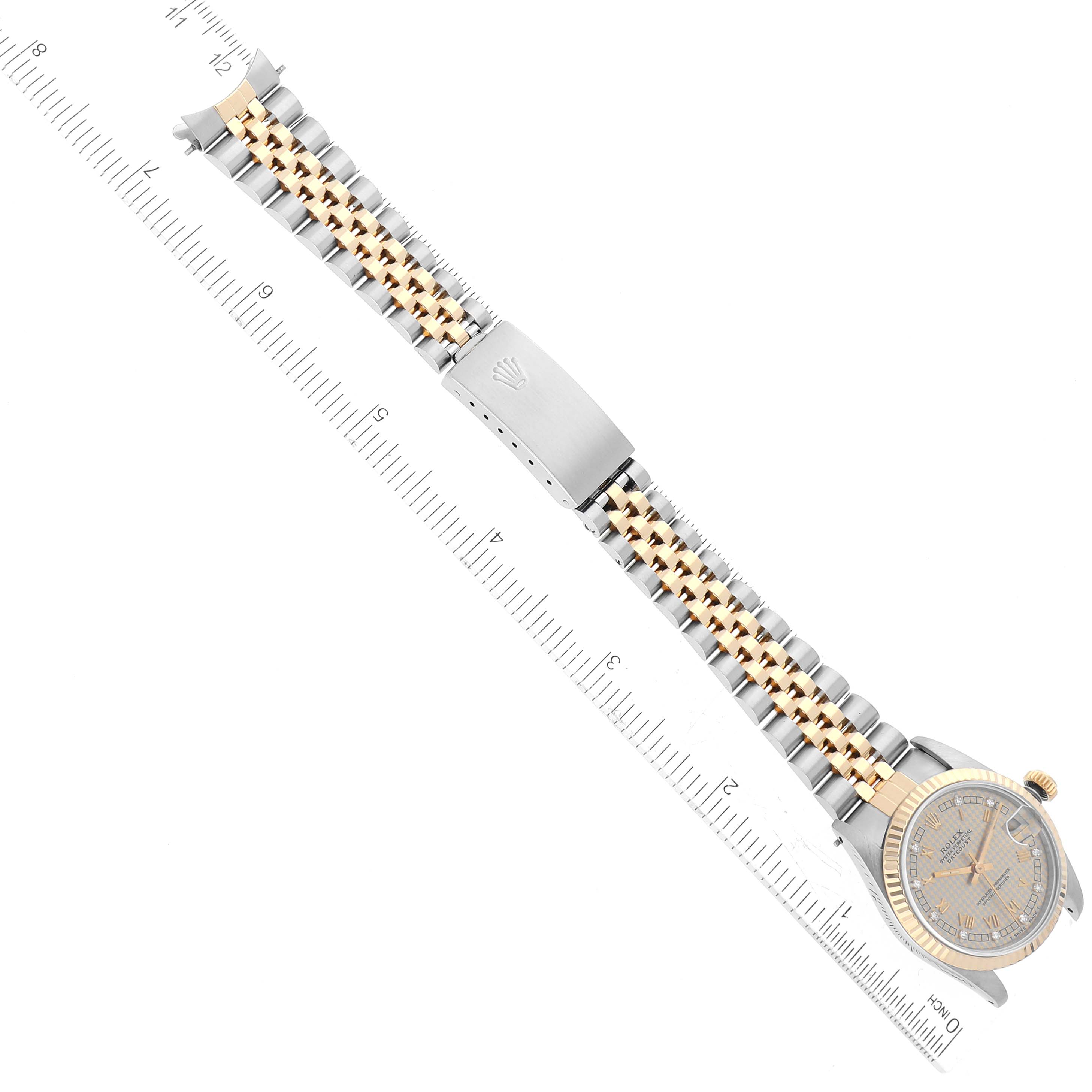 The image shows a Rolex Mid-Size 68273G Women's Steel and Gold (two tone) Champagne Dial 68273G Women's Steel and Gold (two tone) Champagne Dial watch laid flat with the face and two-tone bracelet fully visible next to a ruler.