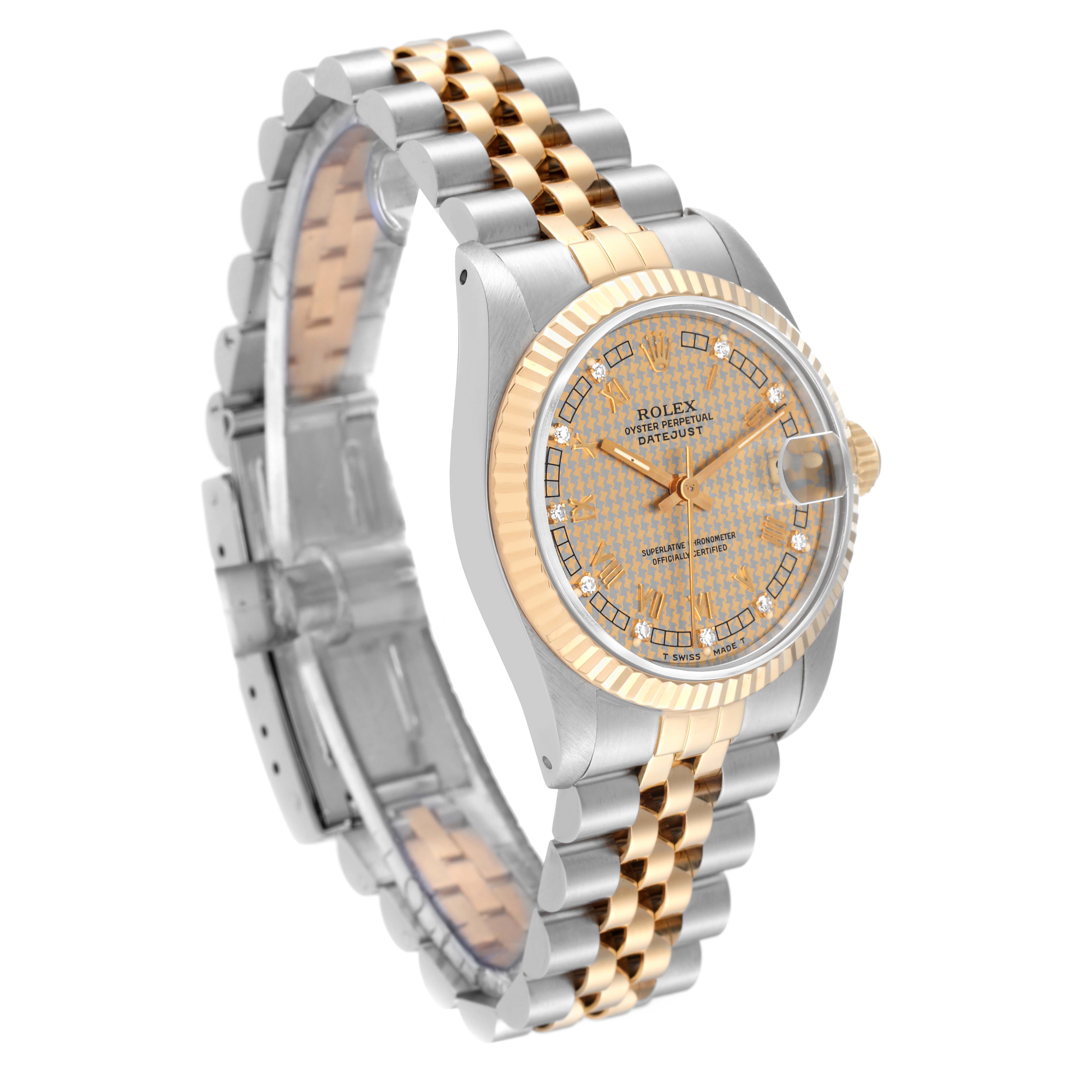 The Rolex Mid-Size 68273G Women's Steel and Gold (two tone) Champagne Dial 68273G Women's Steel and Gold (two tone) Champagne Dial Datejust is shown from a three-quarter angle, featuring the dial, bezel, and part of the bracelet.