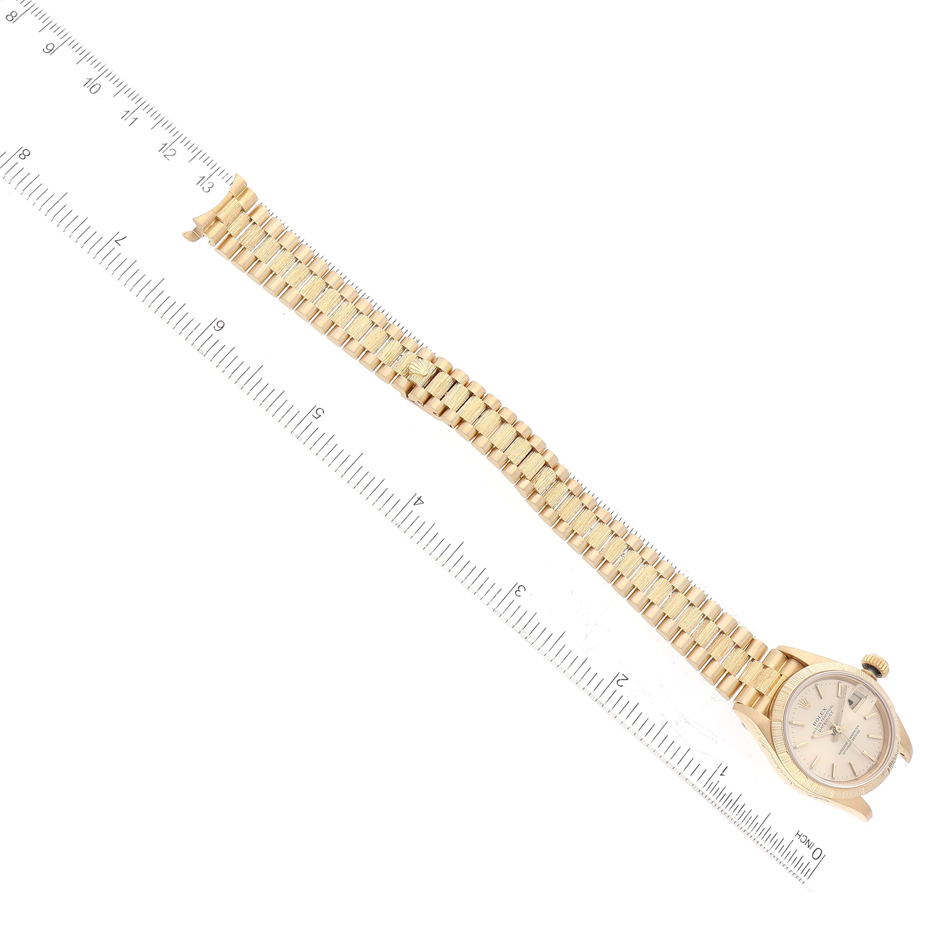 The Rolex President 69278 Women's Yellow Gold Champagne Dial 69278 Women's Yellow Gold Champagne Dial model watch is shown flat with face, band, and ruler for size reference.