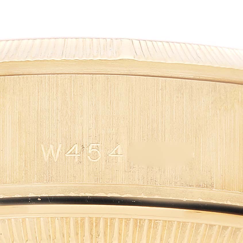 This close-up image shows the serial number area on the case of a Rolex President 69278 Women's Yellow Gold Champagne Dial 69278 Women's Yellow Gold Champagne Dial model watch.