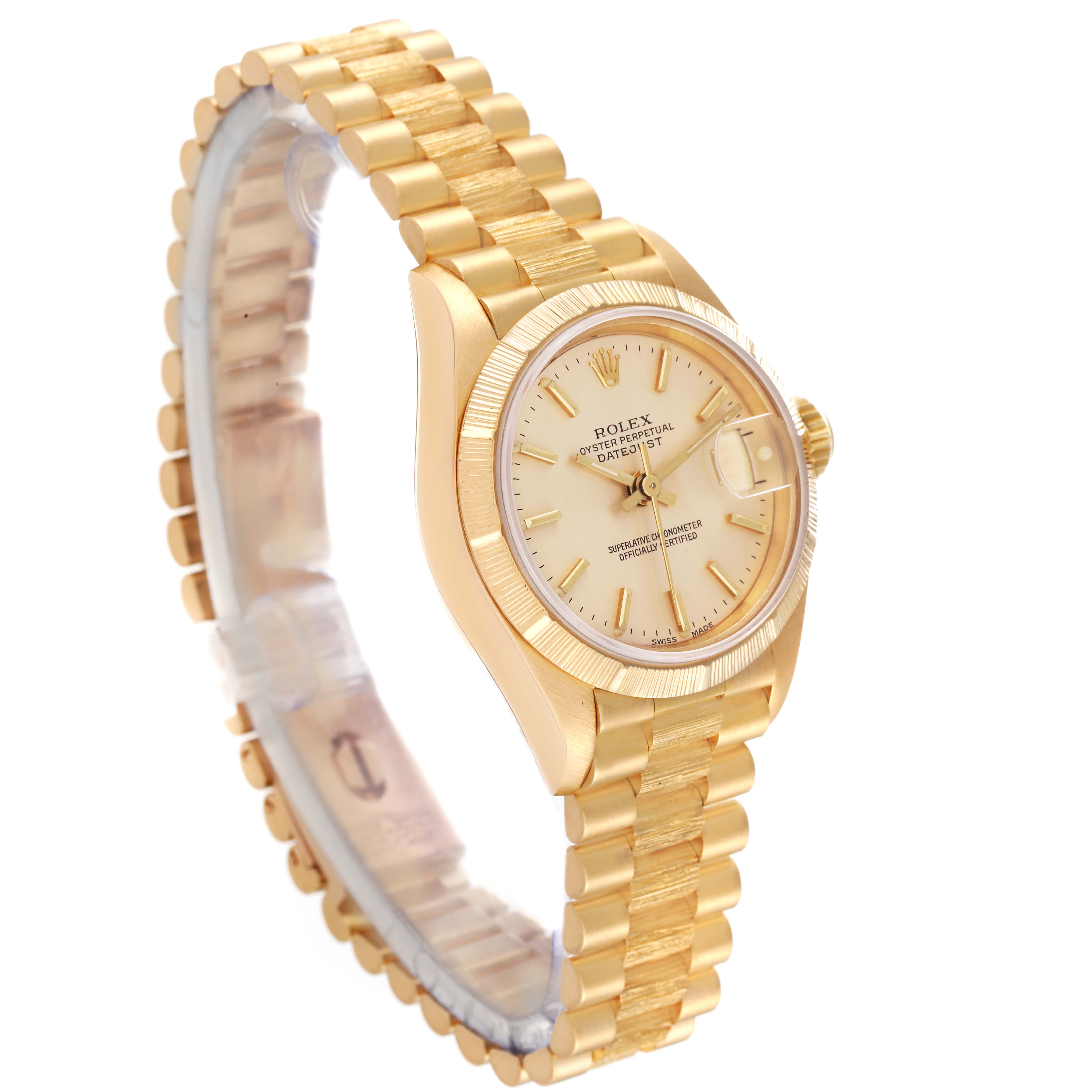 The Rolex President 69278 Women's Yellow Gold Champagne Dial 69278 Women's Yellow Gold Champagne Dial model watch is shown at an angle displaying the bracelet, dial, and partially the clasp.