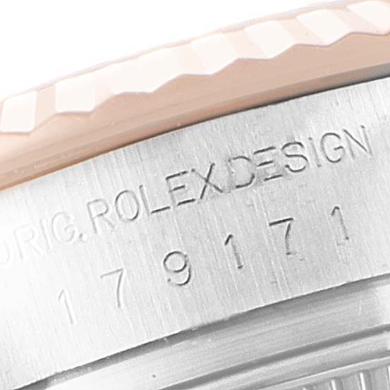 This close-up image shows the side of the bezel and case of the Rolex Datejust 179171 Women
s Steel and Gold (two tone) Mother of Pearl Dial 179171 Women
s Steel and Gold (two tone) Mother of Pearl Dial watch, highlighting the engravings.
