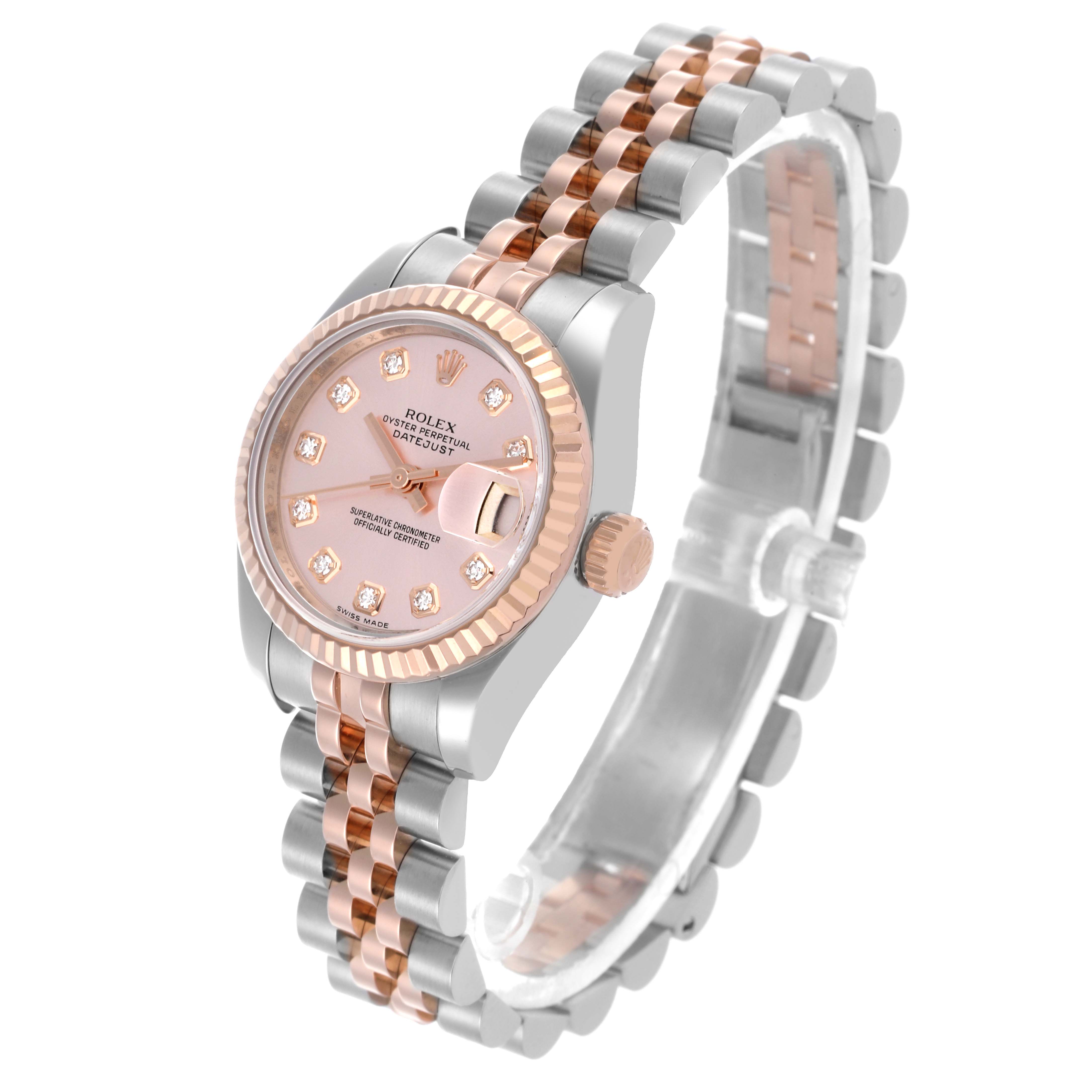 The Rolex Datejust 179171 Women's Steel and Gold (two tone) Pink Dial 179171 Women's Steel and Gold (two tone) Pink Dial watch is shown at an oblique angle, displaying its face, bezel, and part of the bracelet.