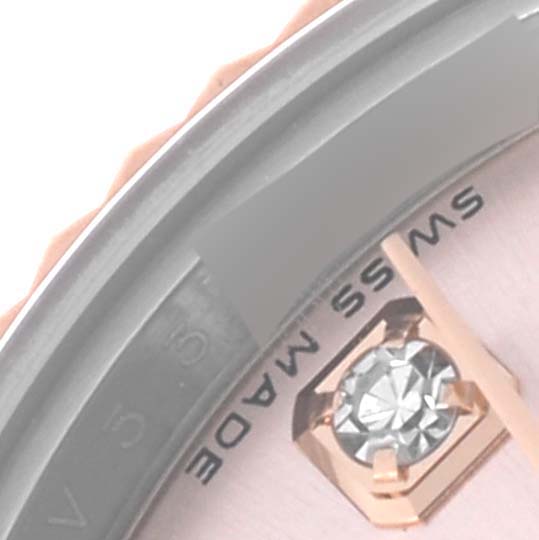 The image shows a close-up of the dial edge and a diamond marker on a Rolex Datejust 179171 Women's Steel and Gold (two tone) Pink Dial 179171 Women's Steel and Gold (two tone) Pink Dial watch, highlighting "SWISS MADE."