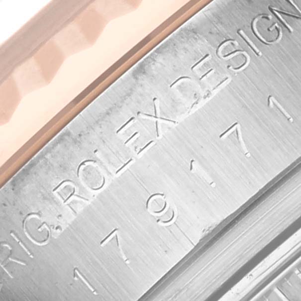 The image shows a close-up of the side engraving on the bezel of the Rolex Datejust 179171 Women's Steel and Gold (two tone) Pink Dial 179171 Women's Steel and Gold (two tone) Pink Dial watch.