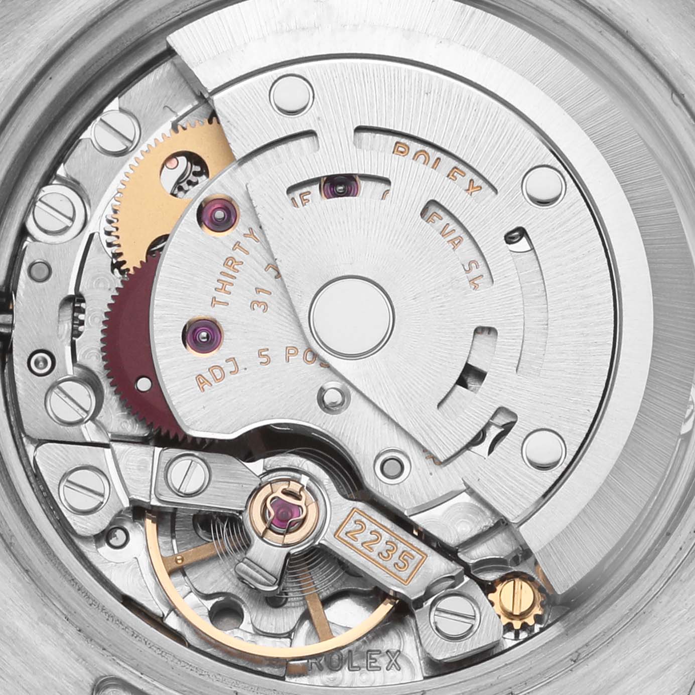 The image shows a close-up of the Rolex Datejust 179171 Women's Steel and Gold (two tone) Pink Dial 179171 Women's Steel and Gold (two tone) Pink Dial's movement and internal mechanics from a rear angle.