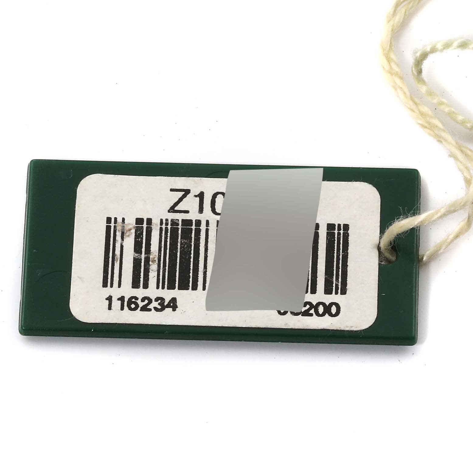 This image shows a rectangular green tag with a barcode for a Rolex Datejust 116234 Men's Stainless Steel Silver Dial 116234 Men's Stainless Steel Silver Dial model.