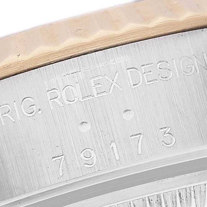 The image shows a close-up of the casing with the engraved model number for a Rolex Datejust 79173 Women's Steel and Gold (two tone) White Dial 79173 Women's Steel and Gold (two tone) White Dial watch.