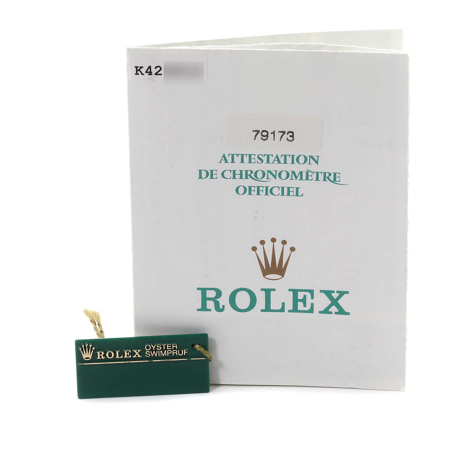 This image shows the certification booklet and tag for a Rolex Datejust 79173 Women's Steel and Gold (two tone) White Dial 79173 Women's Steel and Gold (two tone) White Dial model.
