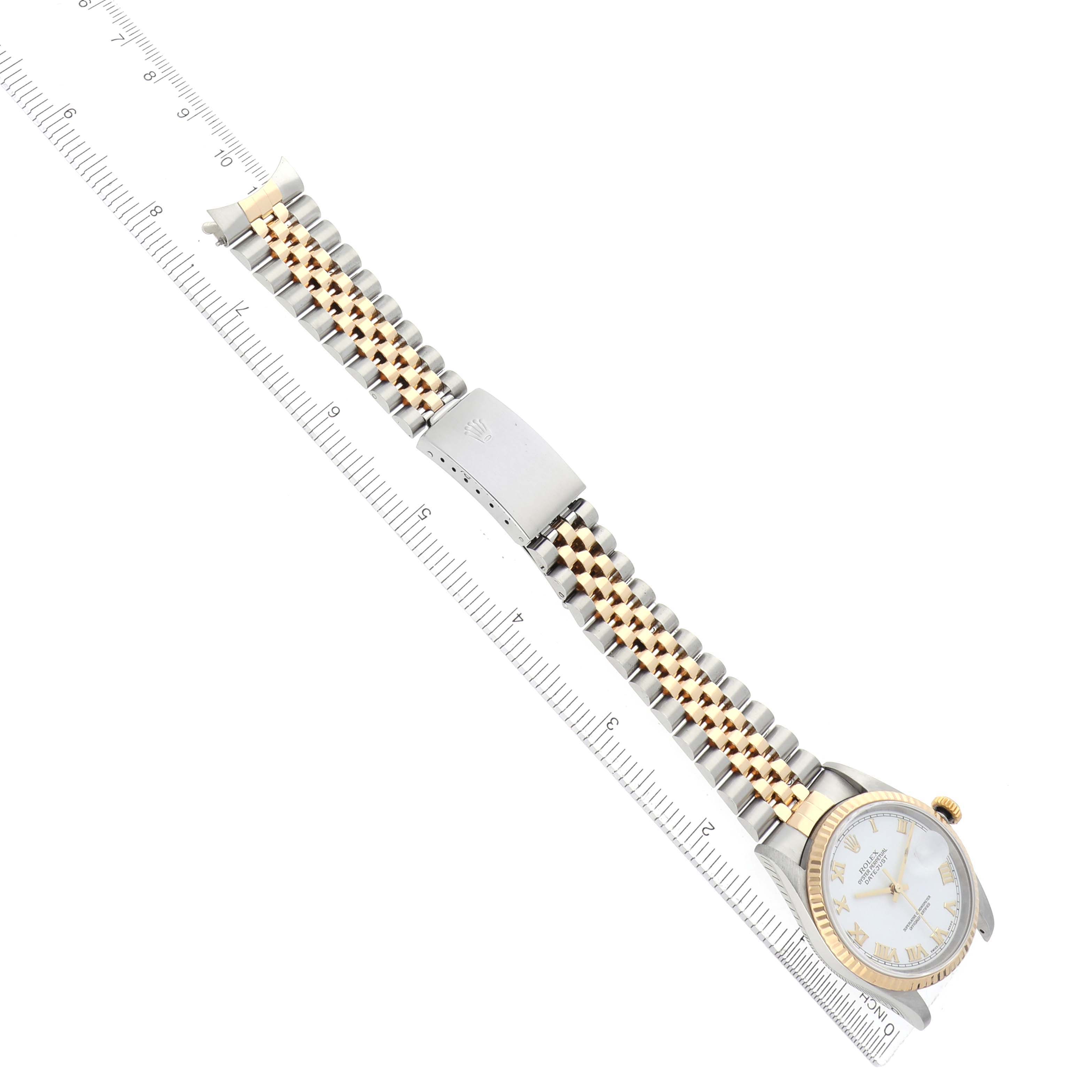 The Rolex Datejust 16233 Men's Steel and Gold (two tone) White Dial watch is shown from an angled top view, displaying the bracelet, clasp, and face with accompanying measurements.