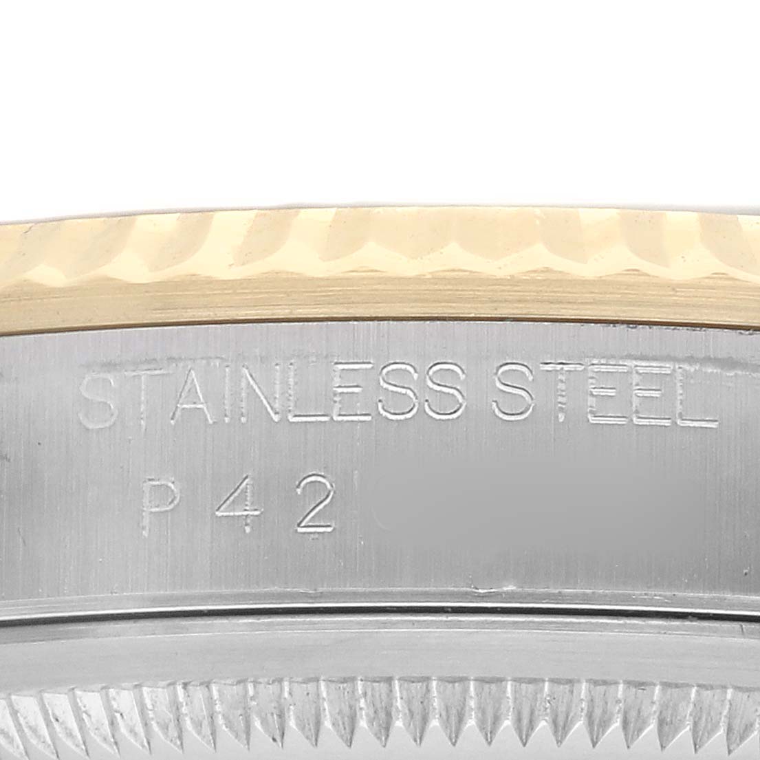 The image shows a close-up of the side of a Rolex Datejust 16233 Men's Steel and Gold (two tone) White Dial, focusing on the stainless steel and gold fluted bezel.