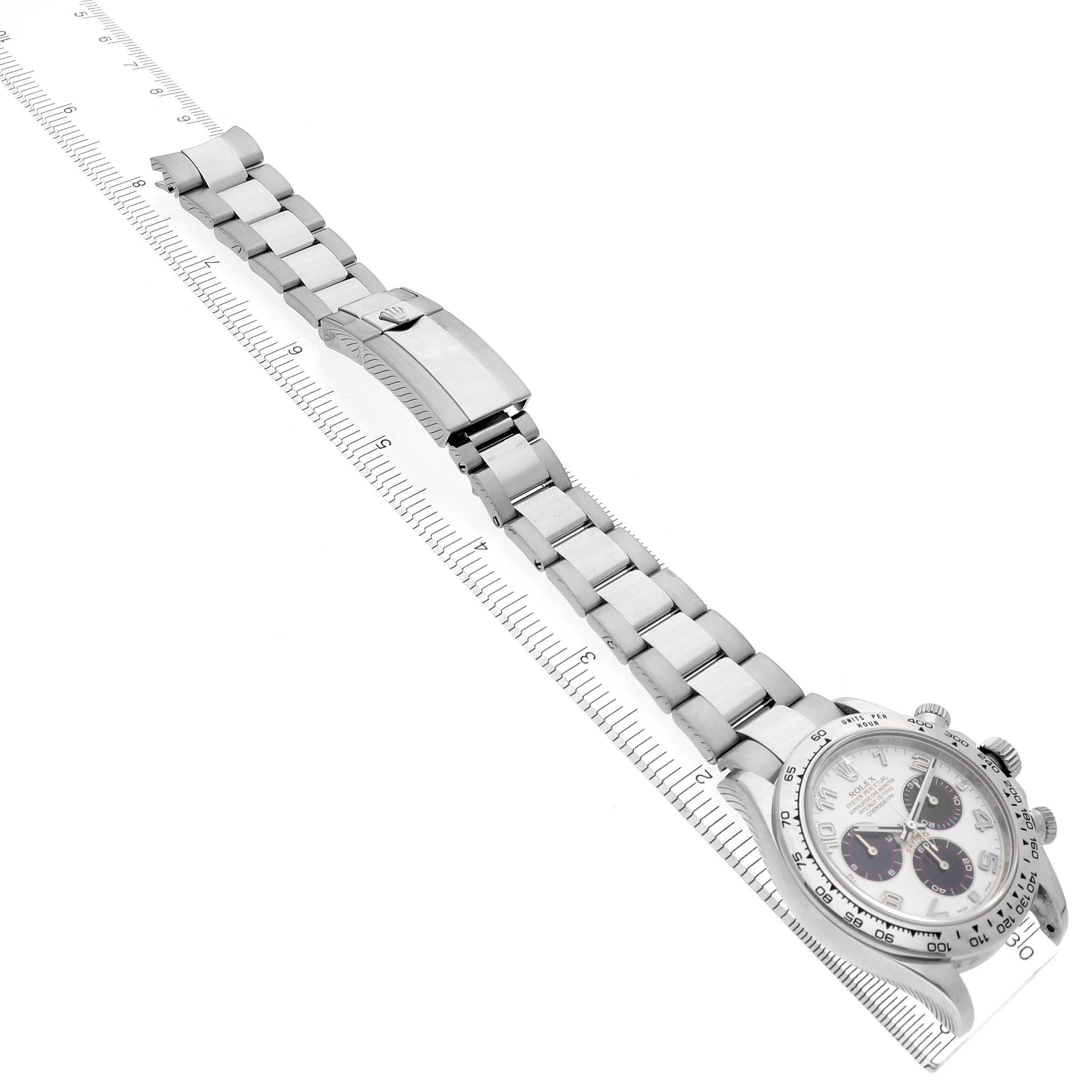 The Rolex Daytona 116509 Men's White Gold White Dial 116509 Men's White Gold White Dial watch is shown from an elevated angle, highlighting the bracelet, clasp, and partial face.