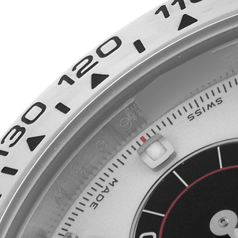 The image shows a close-up angle of the Rolex Daytona 116509 Men's White Gold White Dial 116509 Men's White Gold White Dial's bezel and partial dial, highlighting the tachymetric scale.