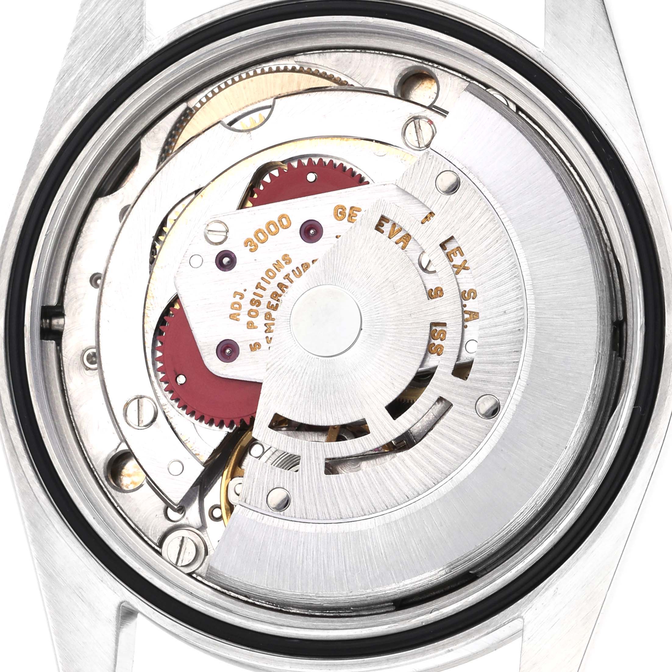 The image shows the movement of a Rolex Explorer 14270 Men's Stainless Steel Black Dial 14270 Men's Stainless Steel Black Dial watch from the back, revealing intricate gears and components.