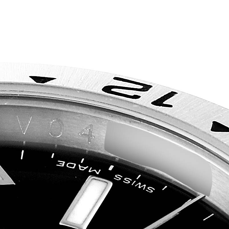 The close-up image shows the bezel, part of the dial, and part of the serial number engraving of a Rolex Explorer 16570 Men
s Stainless Steel Black Dial 16570 Men
s Stainless Steel Black Dial watch.