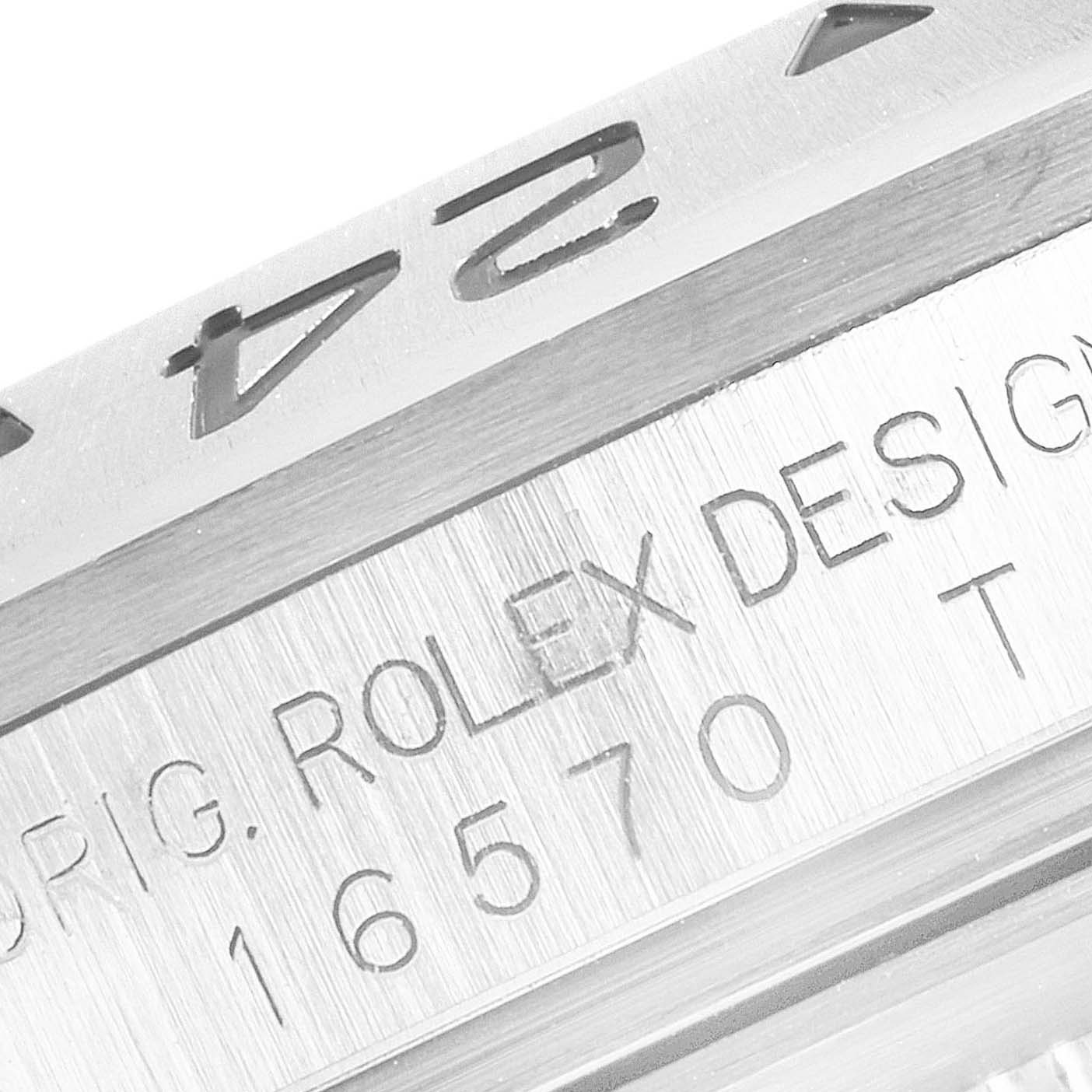 This image shows a close-up of the bezel and case of a Rolex Explorer 16570 Men
s Stainless Steel Black Dial 16570 Men
s Stainless Steel Black Dial model, displaying the model number 16570 and "ROLEX DESIGN" engraving.