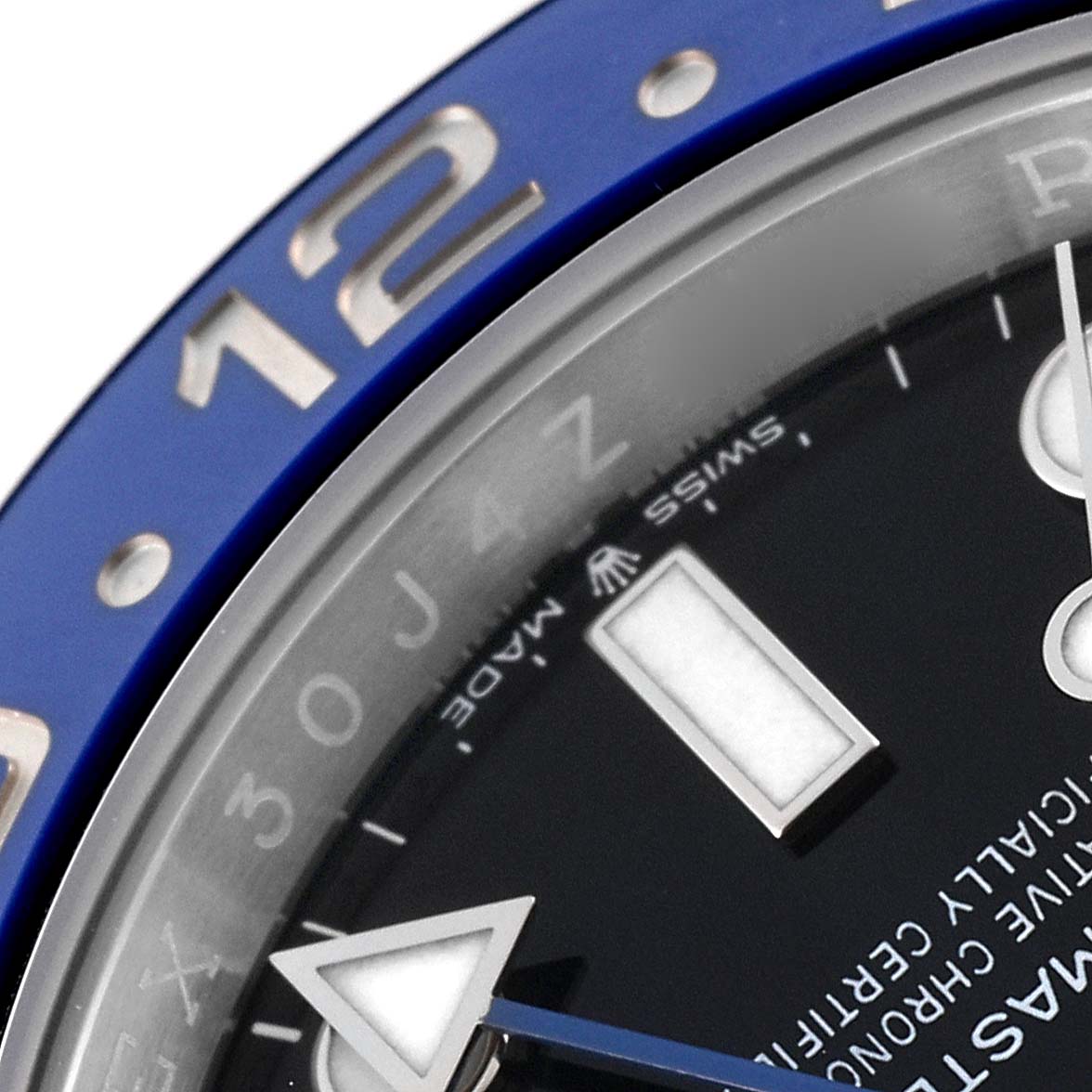 This close-up image of the Rolex GMT-Master 126710BLNR Men
s Stainless Steel Black Dial 126710BLNR Men
s Stainless Steel Black Dial watch shows the bezel, part of the dial, and the hour hand.