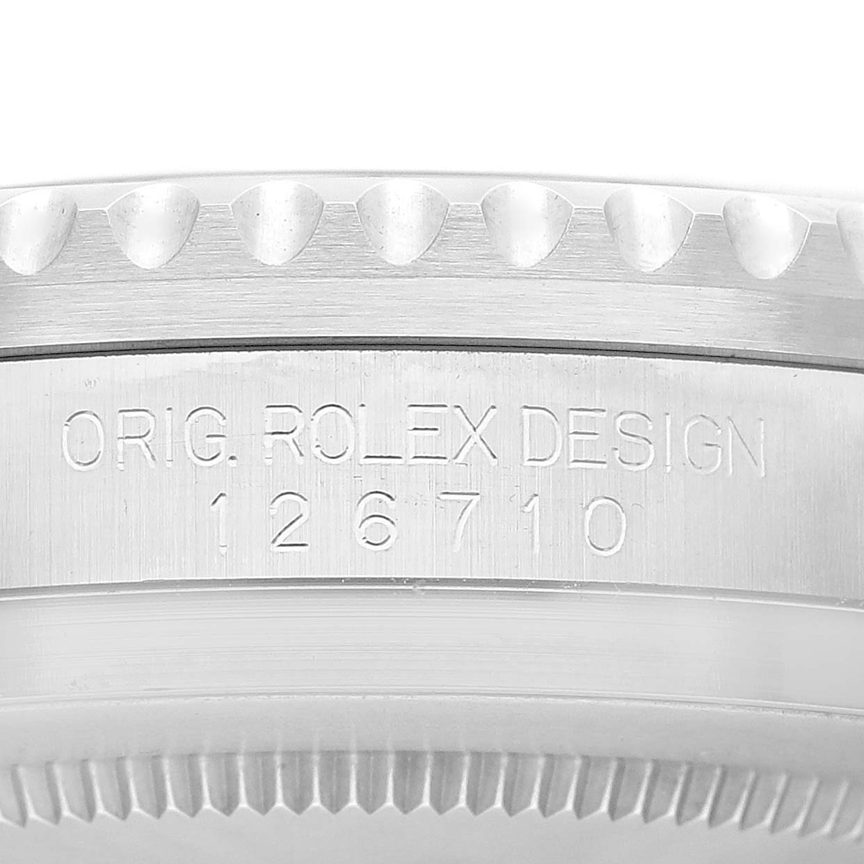 The photo shows a close-up side view of the bezel and case side of a Rolex GMT-Master 126710BLNR Men
s Stainless Steel Black Dial 126710BLNR Men
s Stainless Steel Black Dial watch with model number 126710.