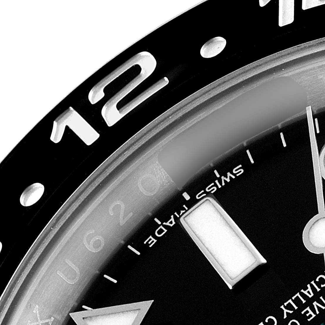 The image shows a close-up of the bezel, dial, and marker of the Rolex GMT-Master 116710 Men
s Stainless Steel Black Dial 116710 Men
s Stainless Steel Black Dial watch, focusing on the 12 o
clock position.
