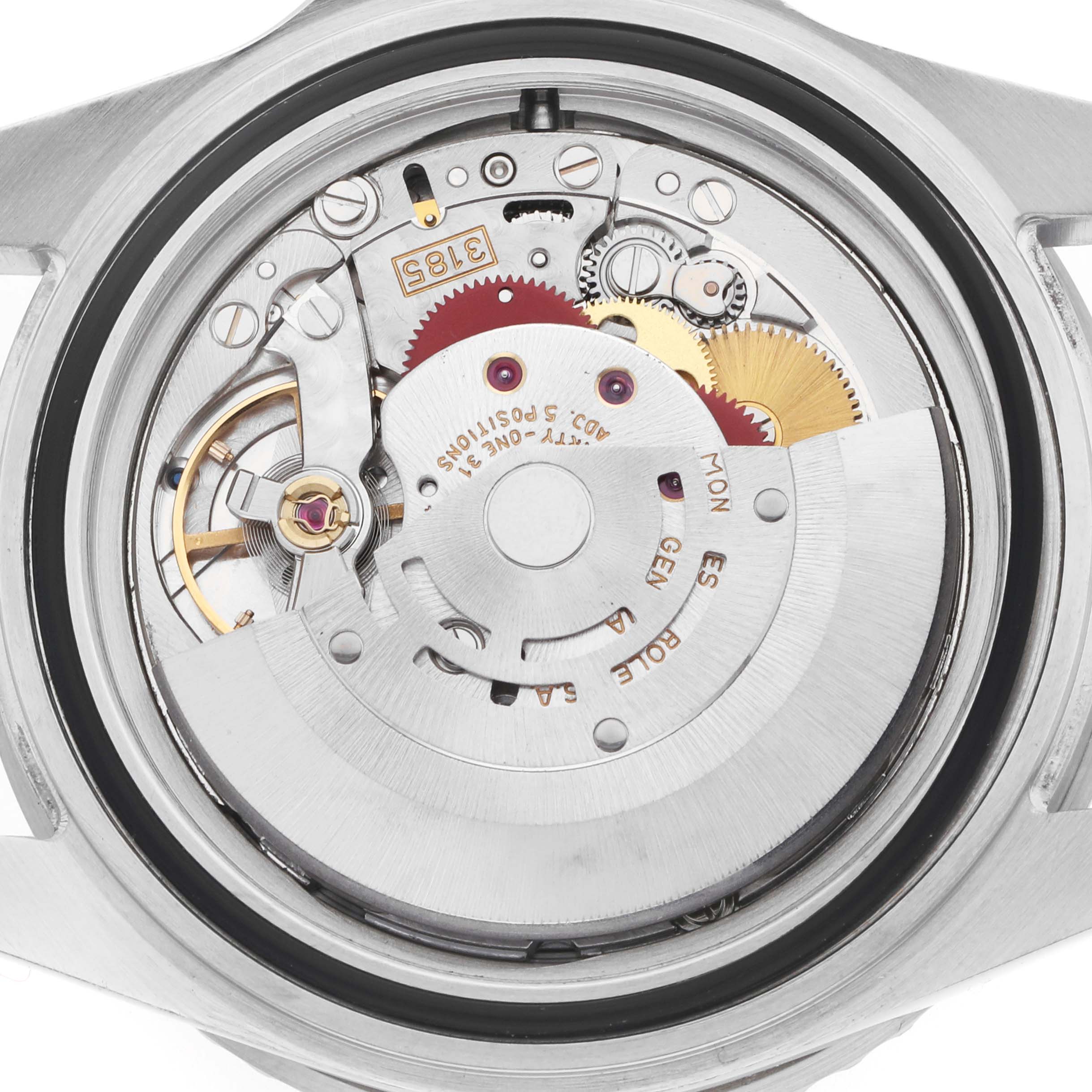 The image shows the movement of a Rolex GMT-Master 16710 Men's Stainless Steel Black Dial watch from the backside, highlighting gears and intricate mechanisms.